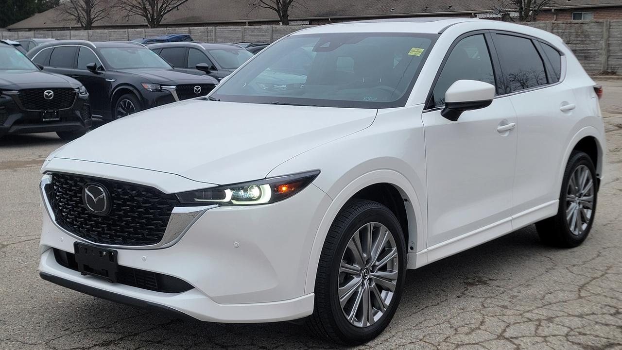 2022 Mazda CX-5 Signature  Luxury, Performance & Style in One Package<br><br>Experience refined driving with this 2022 Mazda CX-5 Signature, the top-tier trim that blends premium comfort with sporty performance. Powered by a responsive 2.5L turbocharged engine, this SUV delivers up to 250 horsepower (with premium fuel), paired with a smooth 6-speed automatic transmission and i-Activ AWD for confident handling in all conditions.<br><br>Step inside and youre greeted by a beautifully crafted interior featuring Caturra Brown Nappa leather seats, genuine layered wood trim, and a driver-focused cockpit designed for comfort and elegance. The heated and ventilated front seats, along with heated rear seats and steering wheel, ensure year-round comfort.<br><br>Stay connected and entertained with the 10.25-inch Mazda Connect infotainment system, Apple CarPlay & Android Auto, built-in navigation, and a premium Bose 10-speaker audio system for crystal-clear sound.<br><br>Safety is at the forefront with i-Activsense® safety features, including:<br><br>Adaptive Cruise Control with Stop & Go<br>Blind Spot Monitoring with Rear Cross Traffic Alert<br>Lane Keep Assist & Lane Departure Warning<br>360° View Monitor<br>Smart Brake Support (front and rear)<br><br>Additional highlights include:<br><br>Power liftgate<br>Sunroof<br>Heads-Up Display (projected on windshield)<br>19-inch alloy wheels<br>Keyless entry with push-button start<br>Wireless phone charging<br><br>With its sleek design, upscale interior, and engaging driving dynamics, the Mazda CX-5 Signature stands out as one of the most refined compact SUVs on the road.