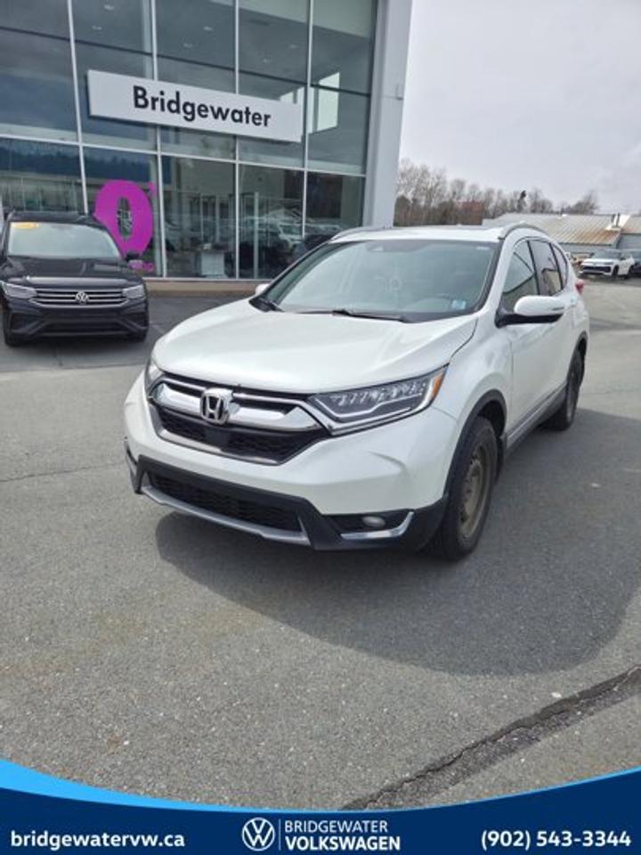 Recent Arrival! 2019 Honda CR-V TouringThis vehicle has passed Motor Vehicle Inspection (MVI) and is road-ready for its next owner. It is being sold without warranty and has not undergone a manufacturer or dealership certification program. Reconditioning & Inspection Includes: Provincial Motor Vehicle Inspection (MVI) Safety-related repairs completed as required to meet inspection standards Basic mechanical and safety checks Final road test Any MVI-related concerns must be reported within the applicable time frame. Any inspection-related concerns must be reviewed and addressed by the original selling dealer.White AWD CVT 1.5L I4 Turbocharged DOHC 16V LEV3-ULEV70 190hp AWD.