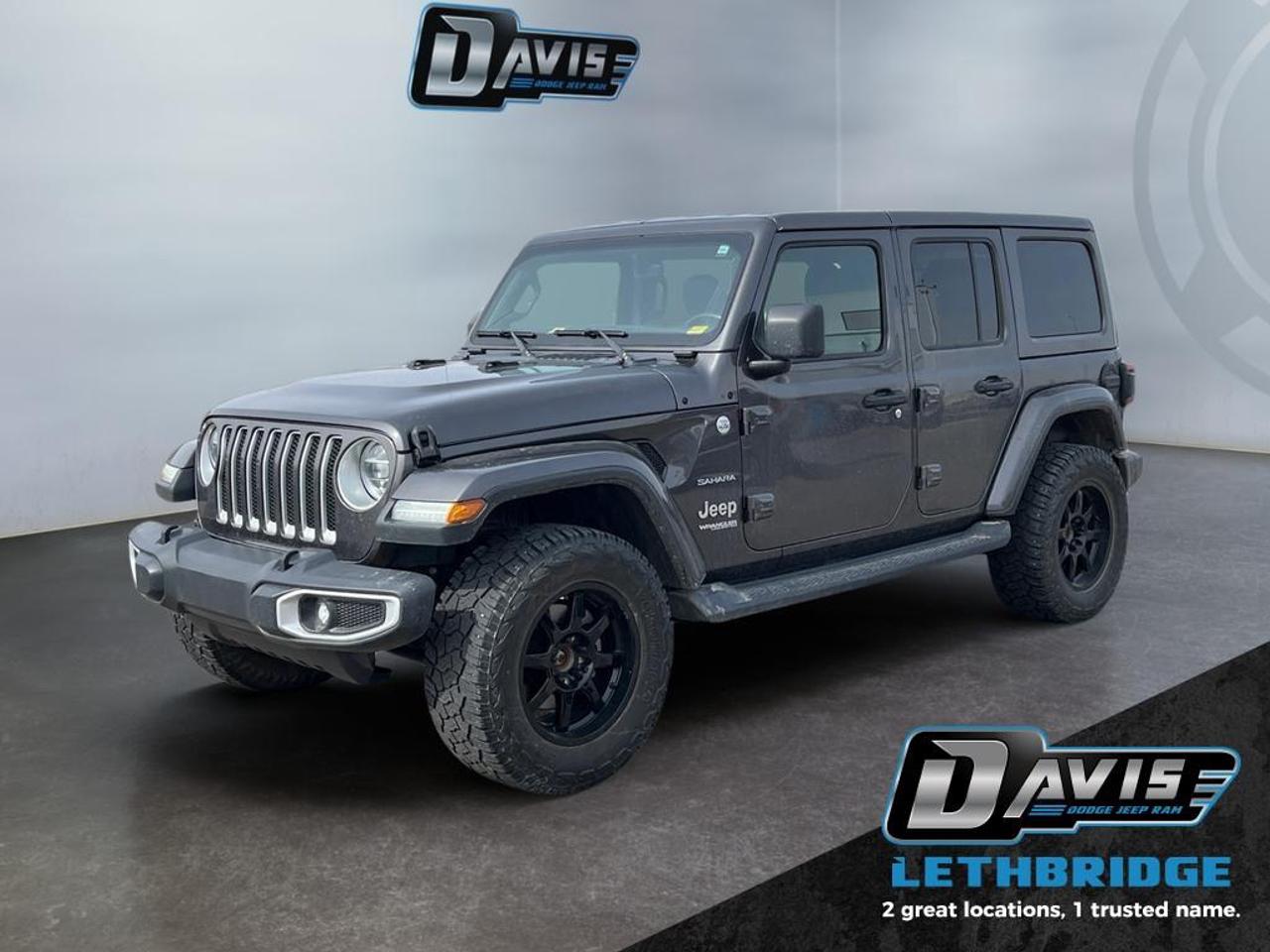 <b>Aluminum Wheels, Android Auto, Apple CarPlay, Dana Axles, Uconnect!</b><br /> <br /> This ultra capable Jeep Wrangler Unlimited was built to be tough and reliable, with next level comfort and convenience. This 2020 Jeep Wrangler Unlimited is fresh on our lot in Lethbridge. <br /> <br />No matter where your next adventure takes you, this Jeep Wrangler Unlimited is ready for the challenge. With advanced traction and handling capability, sophisticated safety features and ample ground clearance, the Wrangler is designed to climb up and crawl over the toughest terrain. Inside the cabin of this Wrangler Unlimited offers supportive seats and comes loaded with the technology you expect while staying loyal to the style and design youve come to know and love. This SUV has 113,000 km. Stock number 41334 is Grey in colour. It has an Automatic transmission and is powered by a 270HP 2.0L 4 Cylinder Engine. <br /> <br /> Our Wrangler Unlimited's trim level is Sahara. This Unlimited Sahara Wrangler has a lot more goodies over the lower Sport model. To make sure you and your passengers stay connected and entertained, you will get Uconnect 4 with a 7 inch touchscreen, Apple CarPlay, Android Auto, SiriusXM, Bluetooth streaming audio and 4 USB's, 8 speakers, plus ambient interior LED lighting. Skid plates, two front tow hooks and one rear, Dana axles, shift on the fly 4x4 system, heavy duty suspension, fog lights, automatic headlamps, aluminum wheels, and tubular side steps help you rule the trail, while a rear view camera, illuminated cup holders, steering wheel with audio and cruise control, remote keyless entry, power windows, 115 volt power outlet, automatic climate control, and heated power side mirrors help you stay comfortable on the road. This vehicle has been upgraded with the following features: Aluminum Wheels, Android Auto, Apple CarPlay, Dana Axles, Uconnect, Steering Wheel Audio Control, Fog Lamps.<br /> <br />To apply right now for financing use this link: <a href=https://lethbridge.davisdodge.ca/free-credit-check/ target=_blank rel=nofollow noopener noreferrer>https://lethbridge.davisdodge.ca/free-credit-check/</a><br /><br /> <br /><br />Locally Owned & Trusted for Over 35 Years  Davis Dodge in Lethbridge, AB <br /><br /> At Davis Dodge, weve proudly served the Lethbridge community for more than 35 years, offering an unparalleled car buying experience. Dont just take our word for itour Google reviews speak volumes about our commitment to exceptional service. <br /><br /> Delivery & At-Home Test Drives: Convenient options to suit your lifestyle. <br /><br /> Flexible Financing for Everyone: Get the vehicle you need with financing solutions tailored to your situation. <br /><br /> Full Mechanical Inspections & Professional Cleaning: Every vehicle is thoroughly inspected and cleaned before it hits our lot.<br /><br /> We take all makes and models on trade and offer competitive pricing with inventory that changes daily. Whether you're shopping for a Chrysler, Dodge, Jeep, RAM, or FIAT, our AMVIC Licensed dealership makes it easy to browse, buy, and drive away.<br /><br /> Located in Lethbridge, AB, we proudly serve customers in Fort Macleod, Taber, Claresholm, and Coaldale. Shop online or visit us today to experience the best in sales, service, and selection. Standard bank rates apply; taxes are additional.<br /><br /> Vehicle pricing offer shown expires 2026-04-30. <br /> Come by and check out our fleet of 70+ used cars and trucks and 120+ new cars and trucks for sale in Lethbridge. o~o
