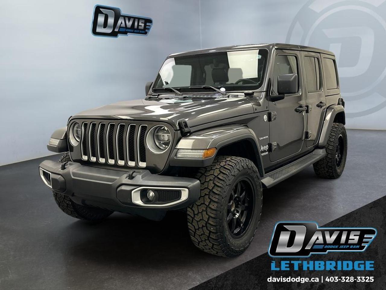 <b>Aluminum Wheels, Android Auto, Apple CarPlay, Dana Axles, Uconnect!<br /> <br /></b><br /> This 2020 Jeep Wrangler Sahara 4x4 delivers iconic off-road capability with modern comfort and technology, powered by an efficient 2.0L turbocharged engine paired with a smooth 8-speed automatic transmission. Equipped with the legendary Command-Trac® 4WD system, heavy-duty suspension, skid plates, and tow hooks, this Wrangler is built to handle rugged terrain while maintaining everyday drivability. Its bold design is enhanced by body-colour accents, side steps, and stylish 18-inch alloy wheels.<br /><br />Inside, the Wrangler Sahara offers a refined and functional cabin with premium McKinley-trimmed seating, heated front seats, and a heated steering wheel for all-season comfort. The 8.4-inch Uconnect® touchscreen with navigation, Apple CarPlay, Android Auto, and Alpine premium audio system keep you connected wherever the roador trailtakes you. Additional features like remote start, keyless entry with push-button start, dual-zone climate control, and a hardtop with removable Freedom Panels add convenience and versatility.<br /><br />Safety and confidence come standard with features like ParkView backup camera, blind spot monitoring, rear park assist, and advanced stability control systems. LED lighting, fog lamps, and automatic headlamps improve visibility, while the trailer tow package adds extra utility. This Wrangler Sahara is the perfect combination of legendary Jeep performance, modern technology, and everyday comfortready for any adventure.<br /> <br />To apply right now for financing use this link: <a href=https://lethbridge.davisdodge.ca/free-credit-check/ target=_blank rel=nofollow noopener noreferrer>https://lethbridge.davisdodge.ca/free-credit-check/</a><br /> <br /><br />Locally Owned & Trusted for Over 35 Years  Davis Dodge in Lethbridge, AB <br /><br /> At Davis Dodge, weve proudly served the Lethbridge community for more than 35 years, offering an unparalleled car buying experience. Dont just take our word for itour Google reviews speak volumes about our commitment to exceptional service. <br /><br /> Delivery & At-Home Test Drives: Convenient options to suit your lifestyle. <br /><br /> Flexible Financing for Everyone: Get the vehicle you need with financing solutions tailored to your situation. <br /><br /> Full Mechanical Inspections & Professional Cleaning: Every vehicle is thoroughly inspected and cleaned before it hits our lot.<br /><br /> We take all makes and models on trade and offer competitive pricing with inventory that changes daily. Whether you're shopping for a Chrysler, Dodge, Jeep, RAM, or FIAT, our AMVIC Licensed dealership makes it easy to browse, buy, and drive away.<br /><br /> Located in Lethbridge, AB, we proudly serve customers in Fort Macleod, Taber, Claresholm, and Coaldale. Shop online or visit us today to experience the best in sales, service, and selection. Standard bank rates apply; taxes are additional.<br /><br /> Vehicle pricing offer shown expires 2026-05-31. <br /> Come by and check out our fleet of 60+ used cars and trucks and 110+ new cars and trucks for sale in Lethbridge. o~o