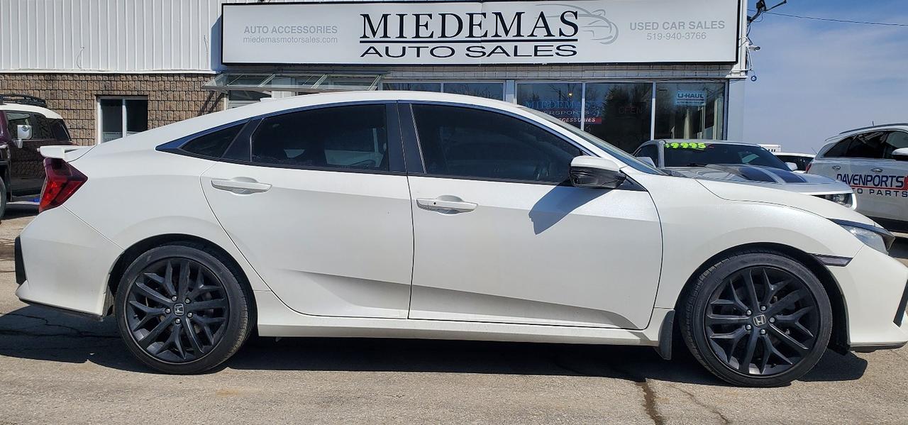 <p>Certified one owner sedan! Manual transmission, front-wheel drivetrain and Hondas reliable and economical 1.5L engine. Heated front seats, power sunroof and back-up camera. Lane departure warning, cross traffic alert and wireless charging station. Bluetooth, navigation and sideview cameras! Price plus taxes and licensing.</p><p>3 year/ 70 000km Lubrico warranty with up to $4000 per eligible claim and $150 deductible available for only an additional $1795+HST</p><p class=MsoNormal>Miedemas has been selling quality used cars since 1973! Honest, professional and friendly staff with that small town feel. No pressure buying! Come see what it takes to keep customers coming for over 40years in business! Financing available on qualified units! Warranty available! All cars sold certified with oil changed and ready to go unless otherwise posted. We&rsquo;re here to help.</p>