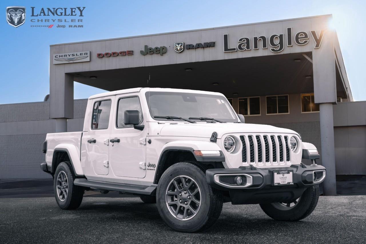 <p><strong>2021 Jeep Gladiator Overland 4x4</strong></p><p>The 2021 Jeep Gladiator Overland is the premium "lifestyle" trim of the world's most off-road capable mid-size truck. It bridges the gap between rugged utility and daily comfort, featuring 18-inch wheels, body-colour fender flares, and a more refined interior compared to the Sport, while still offering the signature removable top and doors for total open-air freedom.</p><p></p><ul><li><p><strong>Engine</strong>: 3.6L Pentastar V6 with Engine Stop/Start (285 hp, 260 lb-ft torque)</p><p></p></li><li><p><strong>Optional Engine</strong>: 3.0L EcoDiesel V6 (260 hp, 442 lb-ft torque)</p><p></p></li><li><p><strong>Drivetrain</strong>: Command-Trac Part-Time 4x4 system with heavy-duty Dana 44 axles</p><p></p></li><li><p><strong>Max Towing</strong>: Up to 2,721 kg (6,000 lbs) with the 3.6L V6 and automatic transmission</p><p></p></li><li><p><strong>Technology</strong>: Uconnect 4 with 7-inch touchscreen (available 8.4-inch NAV), Apple CarPlay, and Android Auto</p><p></p></li><li><p><strong>Key Features</strong>: 18-inch Granite Crystal aluminum wheels, side steps, and available leather-faced seats with accent stitching</p><p></p></li></ul><p>Come book a test drive at Langley Chrysler, conveniently located in Langley, British Columbia.</p>

<p>*All prices plus applicable taxes, applicable environmental recovery charges, documentation of $599 and full tank of fuel surcharge of $76 if a full tank is chosen. <br />Other protection items available that are not included in the above price:<br />Tire & Rim Protection and Key fob insurance starting from $599<br />Service contracts (extended warranties) for coverage up to 7 years and 200,000 kms starting from $599<br />Custom vehicle accessory packages, mudflaps and deflectors, tire and rim packages, lift kits, exhaust kits and tonneau covers, canopies and much more that can be added to your payment at time of purchase<br />Undercoating, rust modules, and full protection packages starting from $199<br />Financing Fee of $500 when applicable<br />Flexible life, disability and critical illness insurances to protect portions of or the entire length of vehicle loan</p>