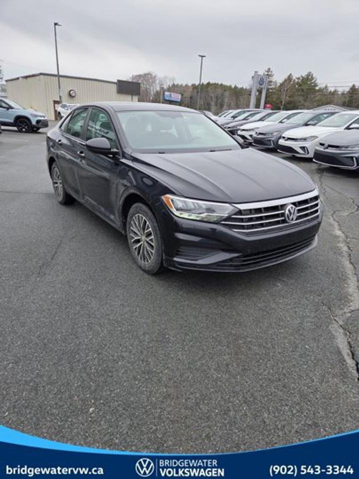 Recent Arrival! 2021 Volkswagen Jetta HighlineApple CarPlay | Android Auto | Sirus XM Certified.This vehicle is a Volkswagen Certified Pre-Owned (CPO) model, meeting Volkswagen Canadas certification standards for quality, reliability, and performance. Volkswagen Certified Reconditioning Includes: Comprehensive Volkswagen multi-point inspection Reconditioning completed to Volkswagen Certified standards Verification of vehicle eligibility and service history Professional detailing and final inspection Volkswagen Certified Pre-Owned vehicles include manufacturer-backed benefits. Any concerns related to the certification process must be reviewed and addressed by the original selling dealer.Deep Black Pearl FWD 8-Speed Automatic with Tiptronic 1.4L TSI Titan Black w/Perforated V-Tex Leatherette Seat Trim, 4-Wheel Disc Brakes, 6 Speakers, ABS brakes, Air Conditioning, Alloy wheels, AM/FM radio: SiriusXM, App-Connect (Android Auto/Apple CarPlay/MirrorLink), Auto-dimming Rear-View mirror, Automatic temperature control, Brake assist, Bumpers: body-colour, Delay-off headlights, Driver door bin, Driver vanity mirror, Dual front impact airbags, Dual front side impact airbags, Electronic Stability Control, Exterior Parking Camera Rear, Front anti-roll bar, Front Bucket Seats, Front dual zone A/C, Front reading lights, Front wheel independent suspension, Fully automatic headlights, Heated door mirrors, Heated Front Comfort Bucket Seats, Heated front seats, Illuminated entry, Leather Shift Knob, Leatherette Seating Surfaces, Low tire pressure warning, Navigation System, Occupant sensing airbag, Outside temperature display, Overhead airbag, Overhead console, Panic alarm, Passenger door bin, Passenger vanity mirror, Power door mirrors, Power moonroof: Rail 2 Rail, Power steering, Power windows, Radio data system, Radio: MIBIII 8.0 Touchscreen Infotainment System, Rain sensing wipers, Rear anti-roll bar, Rear reading lights, Rear window defroster, Remote CD player, Remote keyless entry, Security system, Speed control, Speed-sensing steering, Split folding rear seat, Steering wheel mounted audio controls, Tachometer, Telescoping steering wheel, Tilt steering wheel, Traction control, Trip computer, Variably intermittent wipers, Wheels: 6.5J x 16 Dual-Tone Rama Alloy.