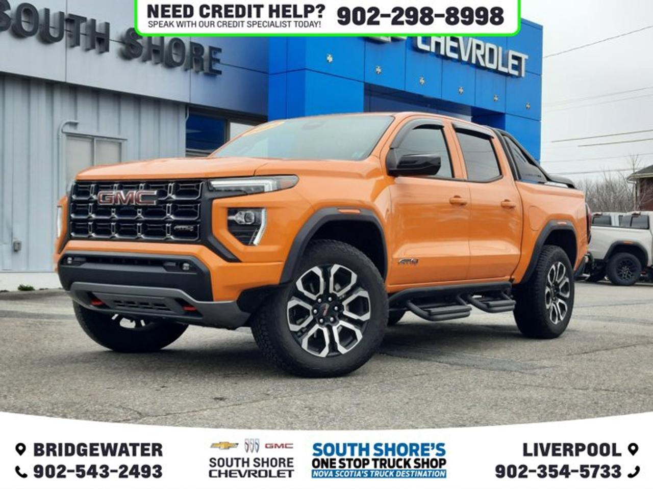 Recent Arrival! Desert Sun 2025 GMC Canyon AT4 For Sale, Bridgewater 4WD 8-Speed Automatic 2.7L I4 Turbocharged DOHC 16V LEV3-SULEV30 310hp Clean Car Fax, 4WD, 120-Volt Bed Mounted Power Outlet, 2 Rear USB Ports in Centre Console (Charge-Only), 6 Speakers, ABS brakes, Air Conditioning, Alloy wheels, AM/FM radio: SiriusXM with 360L, Auto High-beam Headlights, Automatic Emergency Braking, Automatic Stop/Start, Automatic temperature control, Bed-Mounted Tubular Sport Bar (LPO), Black Badges (LPO), Blind Zone Steering Assist w/Trailering, Brake assist, Canyon Pro Safety, Canyon Safety Plus Package, Delay-off headlights, Driver/Passenger Illuminated Sliding Vanity Mirrors, Dual front side impact airbags, Dual-Zone Auto Climate Control Air Conditioning, Electronic Stability Control, Emergency communication system: OnStar, EZ-Lift & Lower Tailgate, Following Distance Indicator, Forward Collision Alert, Front Bucket Seats, Front fog lights, Front LED Fog Lamps, Front Pedestrian & Bicyclist Braking, Heated front seats, Inside Rear-View Auto-Dimming Mirror, IntelliBeam Automatic High Beam On/Off, Interior Overhead Courtesy Light w/Dual Reading Lamp, Lane Keep Assist w/Lane Departure Warning, Low tire pressure warning, MultiStow Tailgate Storage Compartment, Navigation System, Nightfall Edition, Occupant sensing airbag, Off-Road Suspension, Outside temperature display, Overhead airbag, Overhead console, Power Driver Lumbar Control Seat Adjuster, Power driver seat, Power steering, Power windows, Preferred Equipment Group 4SG, Radio data system, Rear Cross Traffic Braking, Rear of Console 120-Volt Power Outlet, Rear window defroster, Remote Vehicle Starter System, Rocker Panel Protector (LPO), Security system, Speed control, Speed-sensing steering, Steering wheel mounted audio controls, Tailgate Keyed Cylinder Lock, Telescoping steering wheel, Tilt & Telescopic Manual Steering Column, Tilt steering wheel, Traction control, Trailering App System, Trip computer, Ultrasonic Rear Park Assist, Variably intermittent wipers, Wheels: 20 x 9 Machined Faced Aluminum.