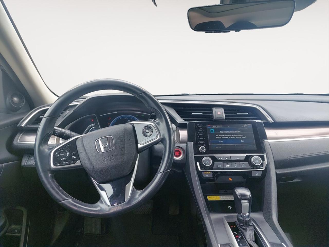 The 2019 Honda Civic Sedan Touring in Blue is your ideal front-wheel-drive companion, offering a smooth and responsive ride. This sedan brings together elegance and practicality, capturing attention with its striking color and refined features. Explore the thoughtfully designed exterior, complete with stylish alloy wheels and heated mirrors, ensuring you stand out on the road. Inside, comfort is elevated with leather seats that extend to both the front and heated rear areas. The leatherette door trim and leather steering wheel add a touch of luxury to every drive. Technologically advanced, this Civic is equipped with a navigation system, a user-friendly smart device integration, and a backup camera that simplifies parking. Drive with added confidence thanks to safety features like lane assist and the adaptive cruise control. The convenience of remote start, keyless entry, and a sunroof add to the sophisticated experience. For those who value style, comfort, and the latest technology in their vehicles, the 2019 Honda Civic Sedan Touring caters to your needs. Contact us today for more information and see how this exceptional sedan can fit your lifestyle.