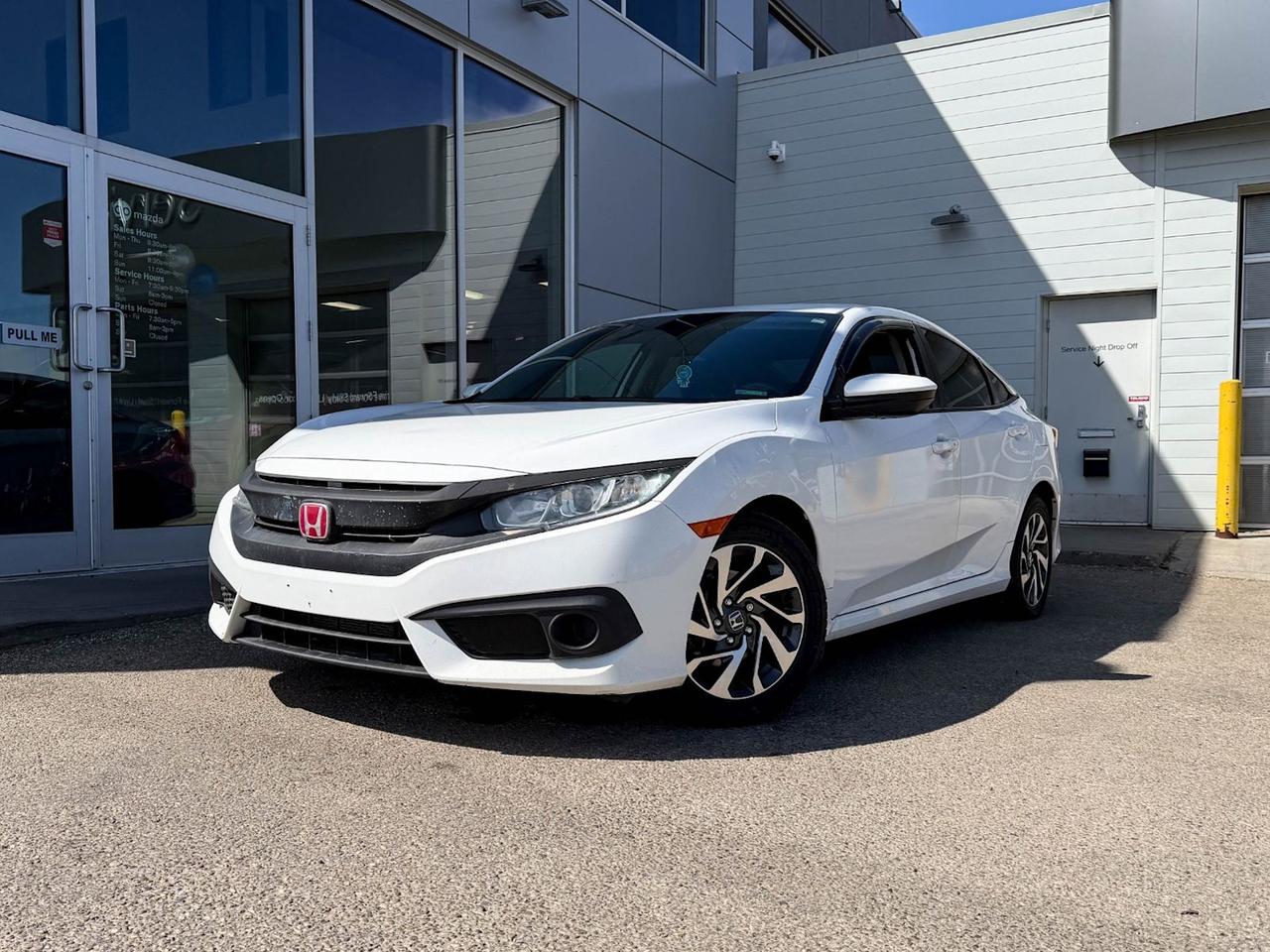 Discover the 2018 Honda Civic Sedan SE CVT in sleek Taffeta White  the perfect blend of style, efficiency, and advanced features. Powered by a responsive 2.0L I-4 engine paired with a smooth Continuously Variable Transmission, it offers a comfortable and confident drive every time. Enjoy heated front bucket seats, a spacious black interior, and a host of tech conveniences including a 7-inch touchscreen, wireless audio streaming, smart device mirroring, and keyless entry with remote start. Safety is paramount with lane departure prevention, forward collision mitigation, and a rearview camera for peace of mind. The Civic SE CVT combines sporty design with practical features like automatic climate control, 16 alloy wheels, and fuel-efficient front-wheel drive. Perfect for commuters and weekend adventurers aliketest drive your 2018 Honda Civic Sedan SE CVT today and experience quality that moves you!This vehicle has been registered in the province ofQuébec andOntario