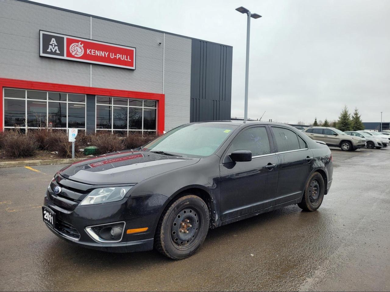 2011 Ford Fusion in Tuxedo Black Metallic. The vehicle has 122,892km. The vehicle runs and drives ok. No check engine light. Rust spots found around the vehicle mainly on the rockers. We dont perform any mechanical/safety inspections. The vehicle is sold as is and might need some work.