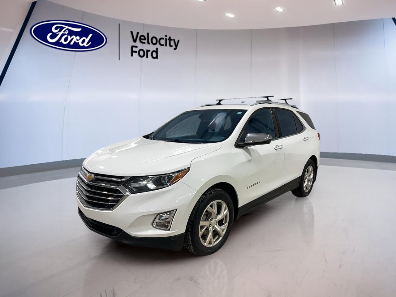 The 2018 Chevrolet Equinox AWD Premier is a smart choice for Moose Jaw drivers who want comfort, efficiency, and year-round confidence. This used SUV pairs a fuel-saving 1.6-litre diesel engine with all-wheel drive and a 6-speed automatic transmission. With 93,840 km, a White exterior, Black interior, and four doors, it offers a refined look and practical everyday value.

FEATURES OF THE Equinox AWD Premier

»» Diesel power with confident all-wheel drive
»» Power liftgate adds daily loading ease
»» Heated front seats for cold mornings
»» Blind spot monitor boosts lane awareness

ADVANCED SAFETY FEATURES

»» Backup camera helps with tight parking
»» Blind spot monitor supports safer lane changes
»» Side impact airbags add occupant protection
»» Stability control helps maintain road grip

PERFORMANCE AND EFFICIENCY

»» 1.6-litre diesel engine saves fuel efficiently
»» All-wheel drive adds four-season confidence
»» Six-speed automatic delivers smooth shifting
»» Cruise control supports relaxed highway driving

COMFORT AND CONVENIENCE

»» Heated front seats improve winter comfort
»» Dual-zone climate control keeps temperatures balanced
»» Remote starter adds convenience in cold weather
»» Power driver seat includes lumbar support

TECHNONOLGY AND CONNECTIVITY

»» Bluetooth integration supports hands-free calling
»» WiFi hotspot keeps devices connected
»» Satellite radio expands entertainment choices
»» Steering wheel audio controls simplify access

CARGO SPACE

»» Power liftgate makes cargo loading easier
»» Rear trunk access improves everyday practicality
»» Four-door layout helps passenger entry
»» Spare tire adds peace of mind

AWARDS & RECOGNITIONS

»» Top Safety Pick, Insurance Institute for Highway Safety, 2018
»» Best New SUV, Automobile Journalists Association of Canada, 2018

WHAT OTHER OWNERS LIKE

»» Quiet highway ride and composed handling
»» Strong fuel economy from diesel engine
»» Comfortable front seating for longer trips
»» Useful technology that feels easy to use

This 2018 Chevrolet Equinox AWD Premier stands out with thoughtful equipment that makes every drive easier. The automatic headlights and fog lights help in changing prairie weather, while heated mirrors, power windows, electric mirrors, and rear window defroster add daily convenience. Push-button start, an auto-dimming rearview mirror, memory mirrors, and memory seats help create a more personalized driving experience.

Inside, the 2018 Chevrolet Equinox AWD Premier is designed for comfort and control. Front air conditioning, automatic climate control, tinted windows, illuminated vanity mirrors, and a leather steering wheel create a pleasant cabin feel. The adjustable steering wheel and steering wheel audio controls help keep everything within easy reach. Child safety locks, head side airbags, passenger airbag sensor, and anti-lock braking system add reassurance for family travel.

This used 2018 Chevrolet Equinox AWD Premier also brings practical value for busy drivers. The power outlet supports devices on the go, while the automatic door locks, turn signal mirrors, and remote trunk release add useful convenience. The dual shift mode transmission gives you added control when wanted, and the power liftgate makes loading groceries, sports gear, or travel bags simple and efficient.

This 2018 Chevrolet Equinox AWD Premiers VIN is: 3GNAXXEU6JS545447.