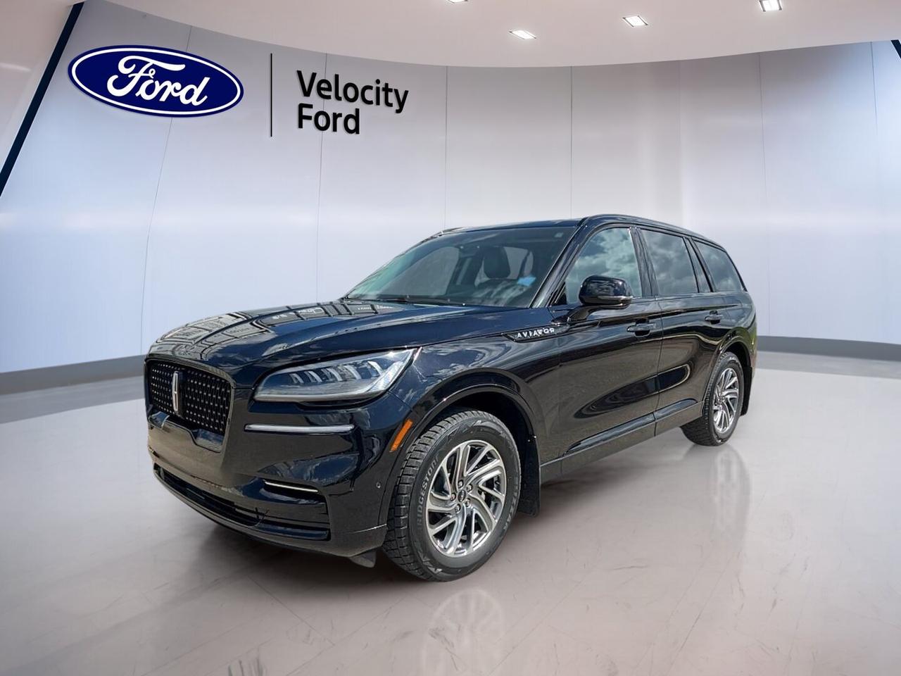Built for families who want luxury, power, and smart utility, this used 2023 Lincoln Aviator Reserve AWD delivers a refined drive in every season. It pairs a 3.0-litre unleaded engine with automatic transmission and all-wheel drive confidence. Finished in Black with a Black interior, this four-door SUV has 24,509 km and is offered by Velocity Ford in Moose Jaw.

The 2023 Lincoln Aviator Reserve AWD blends strong acceleration with upscale comfort and useful technology. Its panoramic sunroof opens the cabin, while heated and ventilated seating features help keep passengers comfortable year-round. With navigation, Wi-Fi hotspot capability, and a power liftgate, this SUV is ready for daily driving, road trips, and busy family life.

FEATURES OF THE Aviator Reserve AWD
»» Panoramic sunroof brightens the spacious cabin
»» All-wheel drive adds year-round road confidence
»» Power liftgate simplifies daily cargo access
»» Adjustable suspension supports smooth highway travel

ADVANCED SAFETY FEATURES
»» Backup camera helps with safer reversing
»» Blind spot monitor aids lane awareness
»» Lane departure warning supports safer travel
»» Side and head airbags add protection

PERFORMANCE AND EFFICIENCY
»» 3.0-litre engine delivers smooth strong power
»» Automatic transmission shifts with refined response
»» All-wheel drive boosts traction in Canada
»» Adjustable suspension improves ride composure

COMFORT AND CONVENIENCE
»» Heated front seats add cold-weather comfort
»» Heated rear seats help passengers stay warm
»» Dual-zone climate control improves cabin comfort
»» Remote starter helps on cold mornings

TECHNONOLGY AND CONNECTIVITY
»» Navigation system guides trips with clarity
»» Bluetooth integration supports hands-free communication
»» Wi-Fi hotspot keeps devices connected
»» Steering wheel audio controls add ease

CARGO SPACE
»» Power liftgate makes loading more convenient
»» Four-door design supports family-friendly access
»» Rear cargo area suits daily gear
»» Split-use cabin handles passengers and luggage

AWARDS & RECOGNITIONS
»» Top Safety Pick, Insurance Institute for Highway Safety, 2023

WHAT OTHER OWNERS LIKE
»» Smooth power delivery from turbocharged engine
»» Quiet cabin on long highway drives
»» Comfortable seating for front and rear
»» Easy-to-use infotainment and navigation features

This 2023 Lincoln Aviator Reserve AWD also includes cruise control, power steering, anti-lock braking system, stability control, child safety locks, heated mirrors, power windows, front air conditioning, memory seats, adjustable steering wheel, rear spoiler, tinted windows, satellite radio, retractable mirrors, leather steering wheel, automatic headlights, rear audio controls, illuminated vanity mirrors, driver and passenger lumbar support, ambient lighting, push button start, tire pressure monitoring, power front seats, automatic climate control, rear climate control, spare tire, performance tires, HD Radio, auto-dimming rearview mirror, automatic door locks, turn signal mirrors, rear window defroster, and LED headlamps.

This 2023 Lincoln Aviator Reserve AWDs VIN is: 5LM5J7XC2PGL00662.