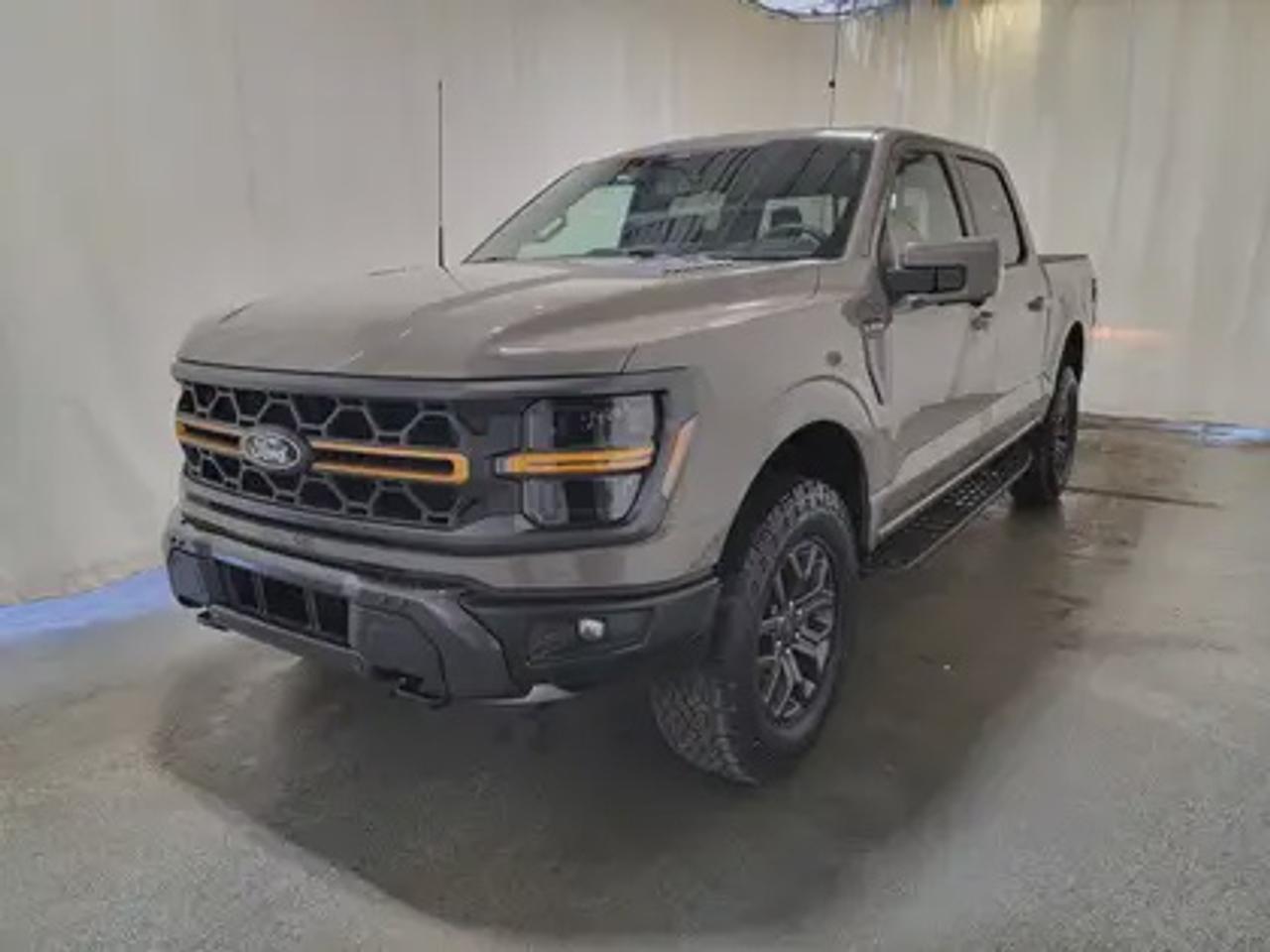The all-new 2025 Ford F-150 Tremor 402A showcased in Marsh Grey. This truck is equipped with the high-performance 3.5L EcoBoost engine, producing 400 horsepower and 500 lb-ft of torque. With its 10-speed automatic transmission, also delivering a combined highway/city fuel economy of 12.9L/100km (22 miles per gallon). 

Key Features:

Bed Utility Package
Mobile Office Package
Tow/Haul Package
Front Axle W/Torsen Differential
Selectable Drive Modes
18 Alloy W/ Dark Matte Finish Wheels
Heated Front Seats & Rear Seats
Ford Co-Pilot 360 Assist 2.0
Adaptive Cruise Control
Lane Centering
Evasive Steering Assist
Front Parking Sensors
Pro Trailer Backup Assist
Pro Trailer Hitch Assist
14 Speaker B&O Unleashed Sound System
Hill Descent Control
Remote Start System
Engine Block Heater
Twin Panel Moonroof

This vehicle comes with the All-Weather Packageready to take on any season!\
Snow, rain, mud, or sunshinethis vehicle is built for it all! The All-Weather Package adds extra protection where it matters most, with premium mud flaps to shield your paint from road debris, all-weather floor mats to protect your interior from lifes messes, and Xpel paint protection to help guard against those infuriating rock chips. Drive with confidence, knowing your investment is protected from Reginas elements.

Bennett Dunlop Ford, proudly serving Regina for over 40 years, is conveniently located at 770 Broad Street. With over 3,500 Google reviews, our reputation reflects our commitment to providing a fast, easy, and enjoyable vehicle-buying experience. We eliminate the hassle with no admin or documentation fees, transparent upfront pricing that lets you shop with total confidence. But were more than just a dealershipwere driven to make a difference by supporting local community initiatives and events that matter to you. Visit Bennett Dunlop Ford today and experience why were Reginas trusted choice for quality vehicles, exceptional service, and a genuine commitment to driving change in our community!