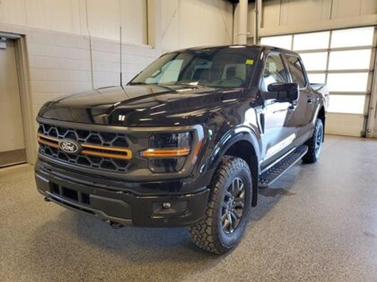 The all-new 2026 Ford F-150 Tremor 402B showcased in Agate Black. This truck is equipped with the high-performance 3.5L EcoBoost engine, producing 400 horsepower and 500 lb-ft of torque. With its 10-speed automatic transmission, also delivering a combined highway/city fuel economy of 12.9L/100km (22 miles per gallon). 

Key Features:
3.73 Electronic-locking rear-axle
Selectable Drive Modes
18 Alloy W/ Dark Matte Finish Wheels
Heated Front Seats 
Ford Co-Pilot 360 Assist 2.0
Adaptive Cruise Control
Lane Centering
Evasive Steering Assist
Front Parking Sensors
Pro Trailer Backup Assist
Pro Trailer Hitch Assist
B&O Sound System
Hill Descent Control
Remote Start System
Engine Block Heater

Moose Jaw Ford, conveniently located at 1010 North Service Road in Moose Jaw, is your trusted destination for all your automotive needs. With an impressive 4.8-star Google rating from nearly 1,500 reviews, we are proud to deliver an exceptional vehicle-buying experience tailored just for you. Our Moose Jaw Motives set us apart, offering unbeatable value like half-priced oil changes for life on pre-owned vehicles, one year of key and remote protection, and one year of tire and rim protection. Enjoy peace of mind with every purchase. At Moose Jaw Ford, were committed to driving positive change in our community by combining exceptional service, high-quality vehicles, and a guest-first approach. Visit us today!