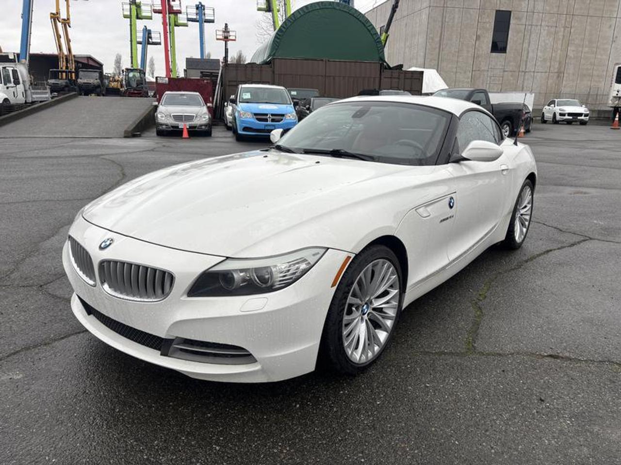 2011 BMW Z4 sDrive35i, 3.0L, 2 door, manual, RWD, 4-Wheel ABS, cruise control, AM/FM radio, power door locks, power windows, power mirrors, white exterior, red interior, leather.  $12,520.00 plus $375 processing fee, $12,895.00 total payment obligation before taxes.  Listing report, warranty, contract commitment cancellation fee, financing available on approved credit (some limitations and exceptions may apply). All above specifications and information is considered to be accurate but is not guaranteed and no opinion or advice is given as to whether this item should be purchased. We do not allow test drives due to theft, fraud, acts of vandalism and undetectable impaired driving. Instead we provide the following benefits: Complimentary Warranty (with options to extend), Limited Money Back Satisfaction Guarantee on Fully Completed Contracts, Contract Commitment Cancellation, and an Open-Ended Sell-Back Option. Ask seller for details or call 604-522-REPO(7376) to confirm listing availability.