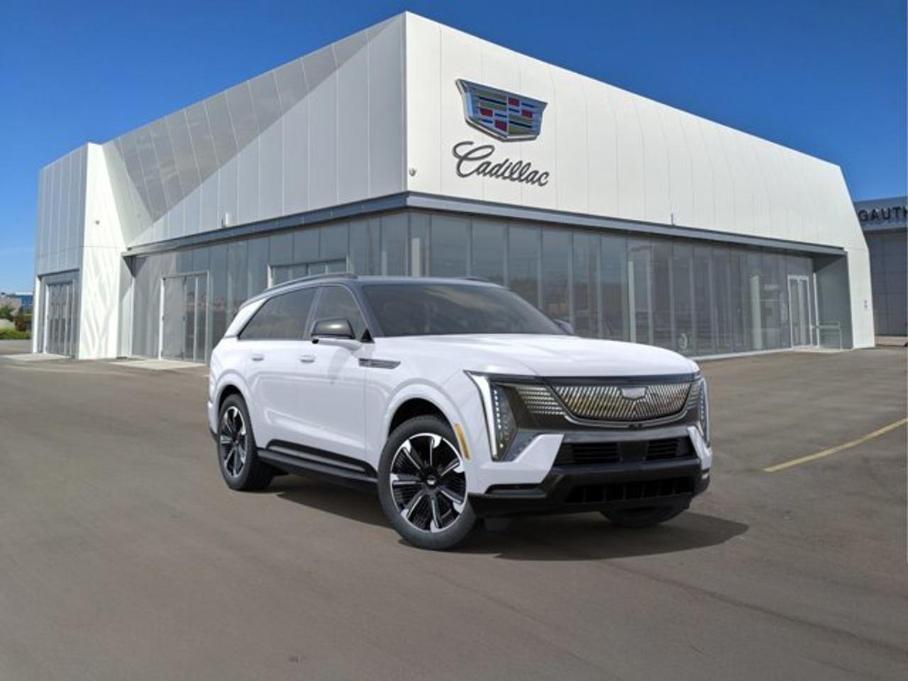The 2026 Cadillac Escalade IQ Sport is a fully electric luxury SUV that delivers up to 750 horsepower through a dual-motor all-wheel-drive system, along with an estimated driving range of roughly 460 miles (about 740 km) on a full charge. It features advanced technology such as a massive 55-inch curved LED display, Super Cruise hands-free driving capability, and a premium AKG audio system, all within a spacious three-row interior. The Sport trim also emphasizes performance and ride comfort with Air Ride Adaptive Suspension, four-wheel steering, and bold, athletic styling elements that give it a more aggressive appearance.