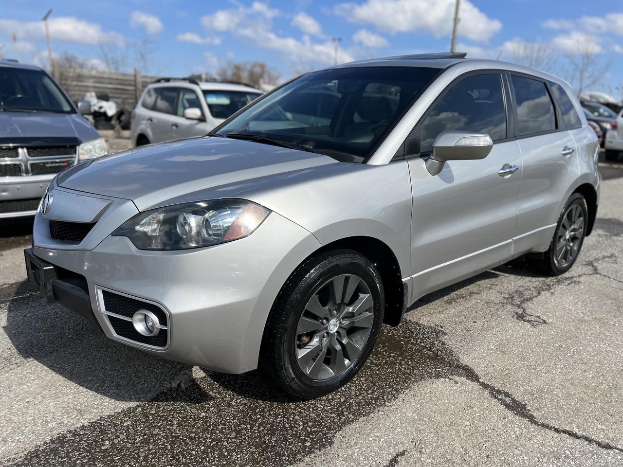 Just Arrived! Beautiful Silver on Beige Leather Interior 2010 ACURA RDX TURBO SH-AWD. Has Only 151,971 Kms. Runs Excellent. No Issues. Local Ontario Vehicle. VERY CLEAN IN AND OUT. 2.3L 4 Cylinder. Loaded with Backup Camera, Heated Power Seats, Leather Seats, Power Sunroof, Keyless Entry, Alarm, Bluetooth, CD/AUX/USB, Fog Lights, 18-inch Aluminum Alloy Wheels, and More! <br/> <br/> <br/> *Safety Certified at no extra cost* <br/> <br/> <br/> *Welcome to get vehicle checked by any mechanic before purchase* <br/> <br/> <br/> All in price : $10,499 plus HST and Licensing. <br/> <br/> <br/> Call or Text: 647-303-2585 or 647-631-8755 <br/> <br/> <br/> Brampton Auto Center <br/> 69 Eastern Avenue, Brampton ON, L6W 1X9. Unit 206 <br/> <br/> <br/> Brampton Auto Center, welcomes you! Family owned dealership located in the GTA. We take pride in our work. Customer service is our priority. Full disclosure with honesty. We are OMVIC registered and proud member of the UCDA. You are welcomed to get the vehicle checked by any mechanic before purchase, for quality assurance. Financing available for all types of credit! Good, bad or no credit. No problem! We will get you approved. Warranty options available for any year, make or model! Contact dealer for more details. <br/> <br/> <br/> E-mail : info@bramptonautocenter.ca <br/>