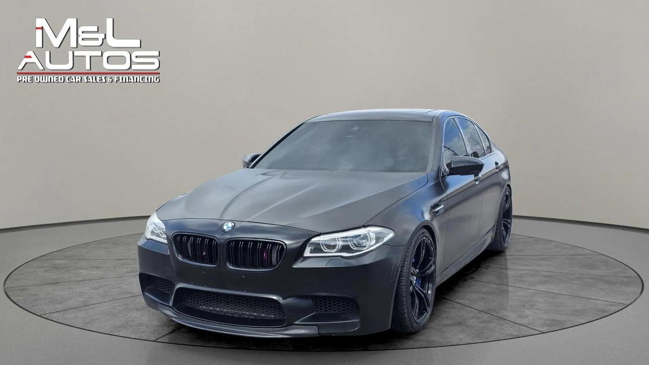 <p data-start=90 data-end=143><strong data-start=90 data-end=141>🔥 For Sale at M&L Autos &ndash; 2014 BMW M5 Sedan 🔥</strong></p><p data-start=145 data-end=333>Experience pure performance and luxury with this <strong data-start=194 data-end=219>2014 BMW M5 4dr Sedan</strong> with <strong data-start=225 data-end=240>147,500 kms</strong> &ndash; a true high-performance machine that blends executive comfort with supercar-level power.</p><p data-start=145 data-end=333>car is loaded with mods! Original color is silver, wrapped matt black.</p><p data-start=335 data-end=880>✅ 4.4L Twin-Turbo V8 &ndash; 560 HP of exhilarating performance<br data-start=392 data-end=395>✅ 7-Speed M-DCT Dual-Clutch Transmission &ndash; lightning-fast shifts<br data-start=459 data-end=462>✅ Rear-Wheel Drive &ndash; true sports sedan dynamics<br data-start=509 data-end=512>✅ M Sport Package &ndash; aggressive styling & performance upgrades<br data-start=573 data-end=576>✅ Premium Leather Interior with Heated & Ventilated Seats<br data-start=633 data-end=636>✅ Head-Up Display & Navigation System<br data-start=673 data-end=676>✅ Harman Kardon Premium Sound System<br data-start=712 data-end=715>✅ Backup Camera, Parking Sensors & Driver Assistance Features<br data-start=776 data-end=779>✅ Power Sunroof, Keyless Entry & Push-Button Start<br data-start=829 data-end=832>✅ 19&rdquo;/20&rdquo; M Alloy Wheels & Signature M Styling</p><p data-start=882 data-end=1023>The BMW M5 delivers <strong data-start=902 data-end=951>track-level performance with everyday comfort</strong>, making it one of the most iconic high-performance sedans ever built.</p><p data-start=1025 data-end=1148>💰 <strong data-start=1028 data-end=1146>Don&rsquo;t miss your chance to own this ultimate driving machine &ndash; contact M&L Autos today to schedule your test drive!</strong></p><p data-start=1150 data-end=1212>📍 <strong data-start=1153 data-end=1166>M&L Autos</strong></p><p data-start=1150 data-end=1212><strong data-start=1153 data-end=1166>$34.999.00 + HST</strong></p><p><strong data-start=1214 data-end=1227>CERTIFICATION PACKAGE - We take your safety very seriously! Each vehicle is PRE-SALE INSPECTED by licensed mechanics (50-point inspection). Certification package can be purchased for only $899. If not Certified, then as per OMVIC Regulations, the vehicle is deemed to be not drivable and not certified Sold.</strong></p>