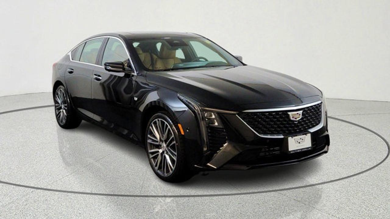 The 2026 Cadillac CT5 Premium Luxury is a midsize luxury sedan powered by a standard 2.0-liter turbocharged engine producing about 237 horsepower, with an available twin-turbo V6 upgrade for stronger performance and optional all-wheel drive. It features a refined interior with heated, ventilated, and massaging seats, along with advanced technology such as a 33-inch curved display, Google built-in, and an AKG premium audio system. The vehicle also emphasizes safety and convenience with features like Super Cruise hands-free driving, HD Surround Vision, and multiple driver-assistance systems including blind zone steering assist and automatic emergency braking.