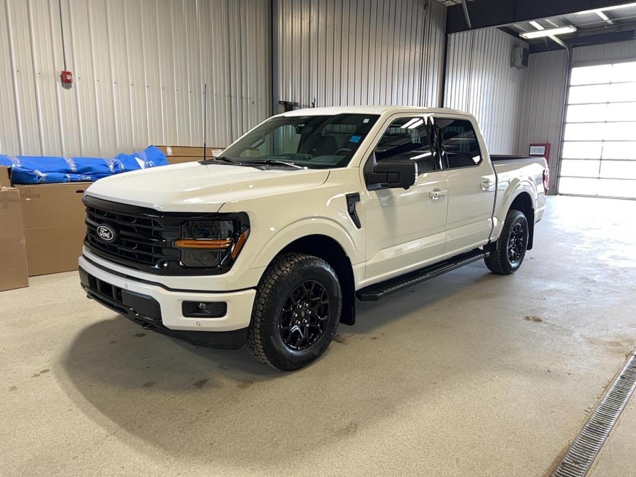 Built for hard work and daily comfort, this brand new 2026 Ford F-150 XLT 4WD SuperCrew 5.5 Box is ready for life in Moose Jaw. Its White exterior and Black interior give it a clean, confident look. With four full doors, automatic transmission, 3.5-litre unleaded power, and four-wheel drive, it delivers the capability Canadian truck buyers expect from a full-size pickup.

FEATURES OF THE F-150 XLT 4WD SuperCrew 5.5 Box
»» SuperCrew cabin adds roomy rear seating
»» Four-wheel drive supports year-round traction
»» Automatic transmission delivers smooth daily driving
»» 5.5-foot box suits mixed-use hauling

TRUCK FEATURES
»» Tows up to 4,671 kg confidently
»» Rear tow hook adds useful recovery support
»» Off-road tires aid rough surface traction
»» Short box helps urban manoeuvrability

ADVANCED SAFETY FEATURES
»» Backup camera helps with reversing visibility
»» Blind spot monitor adds lane awareness
»» Lane departure warning supports safer travel
»» Side and head airbags enhance protection

PERFORMANCE AND EFFICIENCY
»» 3.5-litre unleaded engine delivers strong output
»» Automatic transmission supports smooth power delivery
»» Four-wheel drive improves grip on roads
»» Stability control helps keep handling composed

COMFORT AND CONVENIENCE
»» Cruise control supports relaxed highway driving
»» Front air conditioning keeps cabin comfortable
»» Power windows add everyday ease
»» Driver lumbar support improves long drives

TECHNONOLGY AND CONNECTIVITY
»» Bluetooth integration supports hands-free calling
»» WiFi hotspot helps keep devices connected
»» Satellite radio adds broad entertainment choice
»» Steering wheel audio controls simplify use

CARGO SPACE
»» 5.5-foot box handles daily cargo needs
»» Rear trunk access supports easy loading
»» Four-door cabin adds flexible storage options
»» Spare tire adds peace of mind

AWARDS & RECOGNITIONS
»» 2025 Best Buy Award, The Car Guide

WHAT OTHER OWNERS LIKE
»» Confident towing and hauling everyday utility
»» Spacious SuperCrew cabin for family use
»» User-friendly controls and practical technology
»» Strong four-wheel-drive traction in winter

This brand new 2026 Ford F-150 XLT 4WD SuperCrew 5.5 Box at Velocity Ford gives you the key features that matter most. It includes cruise control, power steering, anti-lock braking system, child safety locks, heated and power mirrors, tinted windows, fog lights, automatic headlights, LED headlamps, tire pressure monitoring, passenger airbag sensor, automatic door locks, and rear window defroster.

Inside, this 2026 Ford F-150 XLT 4WD SuperCrew 5.5 Box focuses on useful comfort and simple function. You get cloth seating, illuminated driver and passenger vanity mirrors, an adjustable steering wheel, and a layout made for workdays, errands, and weekend trips. This is a truck that feels easy to live with while still offering the strength expected from a Ford pickup.

For drivers who need real truck ability without giving up modern essentials, this 2026 Ford F-150 XLT 4WD SuperCrew 5.5 Box is a smart choice. Its balanced mix of safety, traction, towing power, and connected features makes it well suited to Saskatchewan roads, changing weather, and daily demands.

This 2026 Ford F-150 XLT 4WD SuperCrew 5.5 Boxs VIN is: 1FTFW3L85TKD38398.