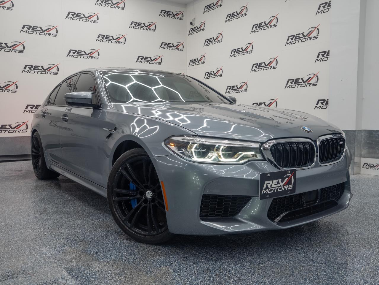 2018 BMW M5 | Stage 2 Tuned | Bowers & Wilkins Surround Sound<br/> <br/> Bluestone Metallic Exterior | Leder Merino / SIlverstone Interior | 19-Inch M Double-Spoke Wheels | Adaptive M Suspension | M Sport Exhaust | Keyless Entry | Heated & Ventilated Front Seats | Heated Rear Seats | Heated Steering Wheel | Quad-Zone Climate Control | 10.25-Inch Touchscreen | Wireless Apple CarPlay | Bowers & Wilkins Diamond Surround Sound | BMW Gesture Control | Adaptive Cruise Control | Lane Departure Warning | Blind Spot Detection | Soft Close Doors | Ambient Air Package | Adaptibe LED Headlights | Driving Assistant Plus | Parking Assistant Pplus | Surround View Camera | Connected Drive Services | Push Button Start | 8-Speed M Steptronic Transmission | xDrive All-Wheel Drive | and more <br/> <br/> <br/> The 2018 BMW M5 Base is a masterclass in performance engineering and executive luxury—designed for those who crave adrenaline without compromising sophistication. <br/> <br/> <br/> Please Be Aware : This vehicle is modified | Tuned (Stage 2) - Carillo Connecting Rod Set (Forged Rod Bearings) - and is FAST <br/> <br/> <br/> Key Features: <br/> <br/> <br/> Track-Bred Power: Under the hood lies a 4.4L TwinPower Turbo V8 that delivers a blistering 600 horsepower. Paired with BMW’s xDrive AWD system and launch control, the M5 rockets from 0 to 60 in just 3.2 seconds—making it one of the fastest sedans in its class. <br/> <br/> <br/> Refined Interior: The White and Black cabin blends elegance with sport. Merino leather seats, ambient lighting, and carbon fiber trim create a cockpit that’s as luxurious as it is driver-focused. <br/> <br/> <br/> Dynamic Handling: With Adaptive M Suspension, rear-biased AWD, and selectable drive modes, the M5 transitions effortlessly from daily comfort to track-ready aggression. <br/> <br/> <br/> Tech-Forward Experience: The 10.25-inch touchscreen with iDrive, wireless Apple CarPlay, gesture control, and a premium Harman Kardon audio system ensure every drive is immersive and intuitive. <br/> <br/> <br/> Safety & Assistance: Advanced features like blind spot detection, lane departure warning, and a surround view camera system provide peace of mind whether youre navigating tight urban corners or open highways. <br/> <br/> <br/> The 2018 BMW M5 Base is the ultimate fusion of luxury and motorsport heritage—built for those who want to dominate the road with elegance, precision, and raw power. <br/> <br/> <br/> This Vehicle has Travelled 78,546 Kms. <br/> <br/> <br/> *** NO additional fees except for taxes and licensing! *** <br/> <br/> <br/> *** 100-point inspection on all our vehicles & always detailed inside and out *** <br/> <br/> <br/> RevMotors is at your service to ensure you find the right car for YOU. Even if we do not have it in our inventory, we are more than happy to find you the vehicle that you are looking for. Give us a call at 613-791-3000 or visit us online at www.revmotors.ca <br/> <br/> <br/> Ça nous donnera du plaisir de vous servir en Français aussi! <br/> <br/> <br/> CERTIFICATION * All our vehicles are sold Certified for the province of Ontario (Quebec Safety Available, additional charges may apply) <br/> FINANCING AVAILABLE * RevMotors offers competitive finance rates through many of the major banks. Should you feel like youve had credit issues in the past, we have various financing solutions to get you on the road. We accept No Credit - New Credit - Bad Credit - Bankruptcy - Students and more!! <br/> EXTENDED WARRANTY * For your peace of mind, if one of our used vehicles is no longer covered under the manufacturer’s warranty, RevMotors will provide you with a 6 month / 6000KMS Limited Powertrain Warranty. You always have the options to upgrade to more comprehensive coverage as well. Well be more than happy to review the options and chose the coverage thats right for you! <br/> TRADES * Do you have a Trade-in? We offer competitive trade in offers for your current vehicle! <br/> SHIPPING * We can ship anywhere across Canada. Give us a call for a quote and we will be happy to help! <br/> <br/> <br/> Buy with confidence knowing that we always have your best interests in mind! <br/>