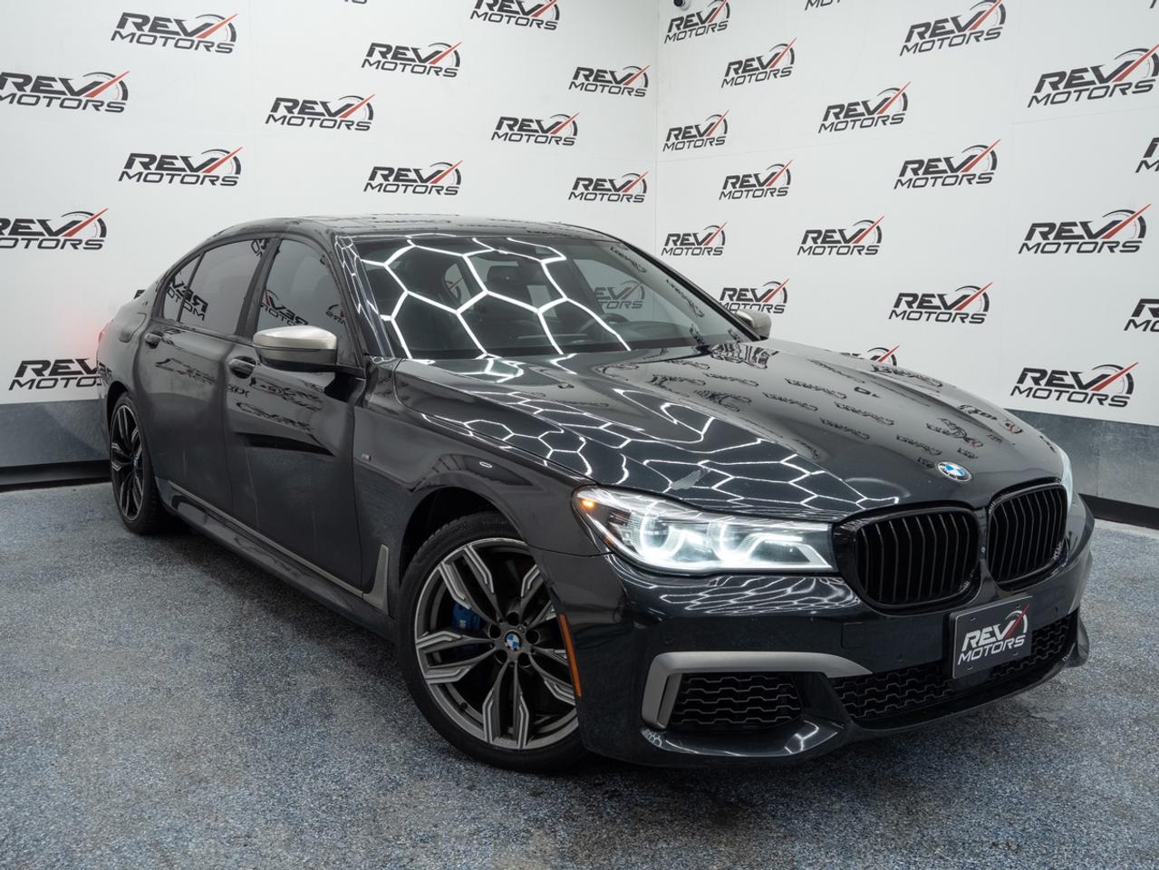 2018 BMW 7 Series M760i xDrive | 6.6L V12 TwinPower Turbo | Executive Package | Driving Assistance | Luxury & Performance Flagship<br/> <br/> Dark Grey Metallic Exterior | Black Nappa Leather Interior | 20-Inch M Light Alloy Wheels | M Aerodynamic Package | LED Adaptive Headlights | Heated & Ventilated Front Seats | Heated Rear Seats | Heated Steering Wheel | Four-Zone Climate Control | Panoramic Sky Lounge | LED Roof iDrive 6.0 with 10.2-Inch Display | Apple CarPlay | Harman Kardon Surround Sound | Soft-Close Doors | Gesture Control | Surround View Cameras | Parking Assistant | Driving Assistance | 8-Speed Sport Automatic | 6.6L V12 TwinPower Turbo | 601 Horsepower xDrive | All-Wheel Drive | and more <br/> <br/> <br/> The 2018 BMW M760i xDrive represents the pinnacle of BMW luxury and performance. Finished in a refined grey exterior over a black leather interior, this flagship sedan blends executive‑level comfort with breathtaking power from its handcrafted V12 engine. <br/> <br/> <br/> Key Features <br/> <br/> <br/> Commanding Presence <br/> The dark grey metallic finish, M Aerodynamic styling, and 20‑inch M alloy wheels give the M760i a confident, understated look. Its long, sculpted profile and signature BMW design elements make it a standout among luxury sedans. <br/> <br/> <br/> First‑Class Interior <br/> Inside, the cabin is crafted with premium black Nappa leather, fine wood trim, and advanced comfort features. Heated and ventilated front seats, heated rear seats, soft‑close doors, and four‑zone climate control create an environment tailored for both driver and passengers. The Panoramic Sky Lounge roof adds a dramatic ambient lighting effect throughout the cabin. <br/> <br/> <br/> Unmatched V12 Performance <br/> At the heart of the M760i is a 6.6L TwinPower Turbo V12 producing 601 horsepower, delivering effortless acceleration and refined power. Paired with BMW’s xDrive all‑wheel drive and an 8‑speed sport automatic transmission, this sedan offers exceptional stability, precision, and smoothness at any speed. <br/> <br/> <br/> Advanced Technology <br/> BMW’s iDrive 6.0 system with a 10.2‑inch display provides seamless access to navigation, Apple CarPlay®, gesture control, and Harman Kardon premium audio. The cabin integrates cutting‑edge technology designed to enhance convenience and entertainment. <br/> <br/> <br/> Safety & Driver Assistance <br/> Equipped with Driving Assistance Plus, surround‑view cameras, parking assistant, and adaptive LED headlights, the M760i offers comprehensive safety and driver‑support features. These systems work together to provide confidence and clarity in every driving situation. <br/> <br/> <br/> The 2018 BMW 7 Series M760i xDrive is the ultimate expression of BMW engineering—combining handcrafted V12 performance, executive‑level luxury, and advanced technology. It’s built for drivers who demand power, prestige, and refinement in every mile. <br/> <br/> <br/> This Vehicle Has Travelled 108,320 Kms <br/> <br/> <br/> *** NO additional fees except for taxes and licensing! *** <br/> <br/> <br/> *** 100-point inspection on all our vehicles & always detailed inside and out *** <br/> <br/> <br/> RevMotors is at your service to ensure you find the right car for YOU. Even if we do not have it in our inventory, we are more than happy to find you the vehicle that you are looking for. Give us a call at 613-791-3000 or visit us online at www.revmotors.ca <br/> <br/> <br/> Ça nous donnera du plaisir de vous servir en Français aussi! <br/> <br/> <br/> CERTIFICATION * This vehicle is sold Certified for the province of Ontario (Quebec Safety Available, additional charges may apply) <br/> FINANCING AVAILABLE * RevMotors offers competitive finance rates through many of the major banks. Should you feel like youve had credit issues in the past, we have various financing solutions to get you on the road. We accept No Credit - New Credit - Bad Credit - Bankruptcy - Students and more!! <br/> EXTENDED WARRANTY * For your peace of mind, if one of our used vehicles is no longer covered under the manufacturer’s warranty, RevMotors will provide you with a 6 month / 6000KMS Limited Powertrain Warranty. You always have the options to upgrade to more comprehensive coverage as well. Well be more than happy to review the options and chose the coverage thats right for you! <br/> TRADES * Do you have a Trade-in? We offer competitive trade in offers for your current vehicle! <br/> SHIPPING * We can ship anywhere across Canada. Give us a call for a quote and we will be happy to help! <br/> <br/> <br/> Buy with confidence knowing that we always have your best interests in mind! <br/>