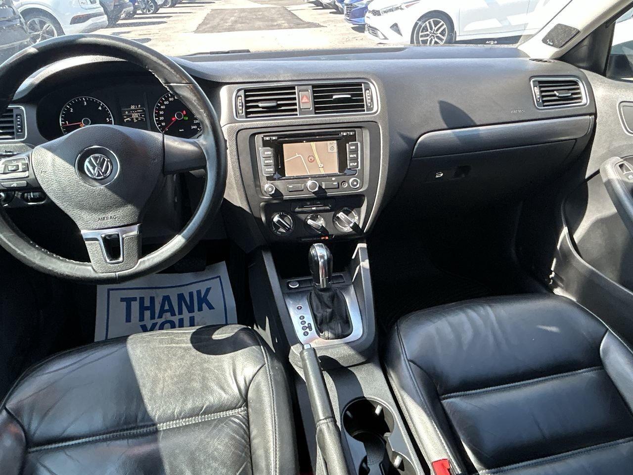2014 Volkswagen Jetta Highline Sunroof   Leather Int   Nav   2 Tire Sets Photo