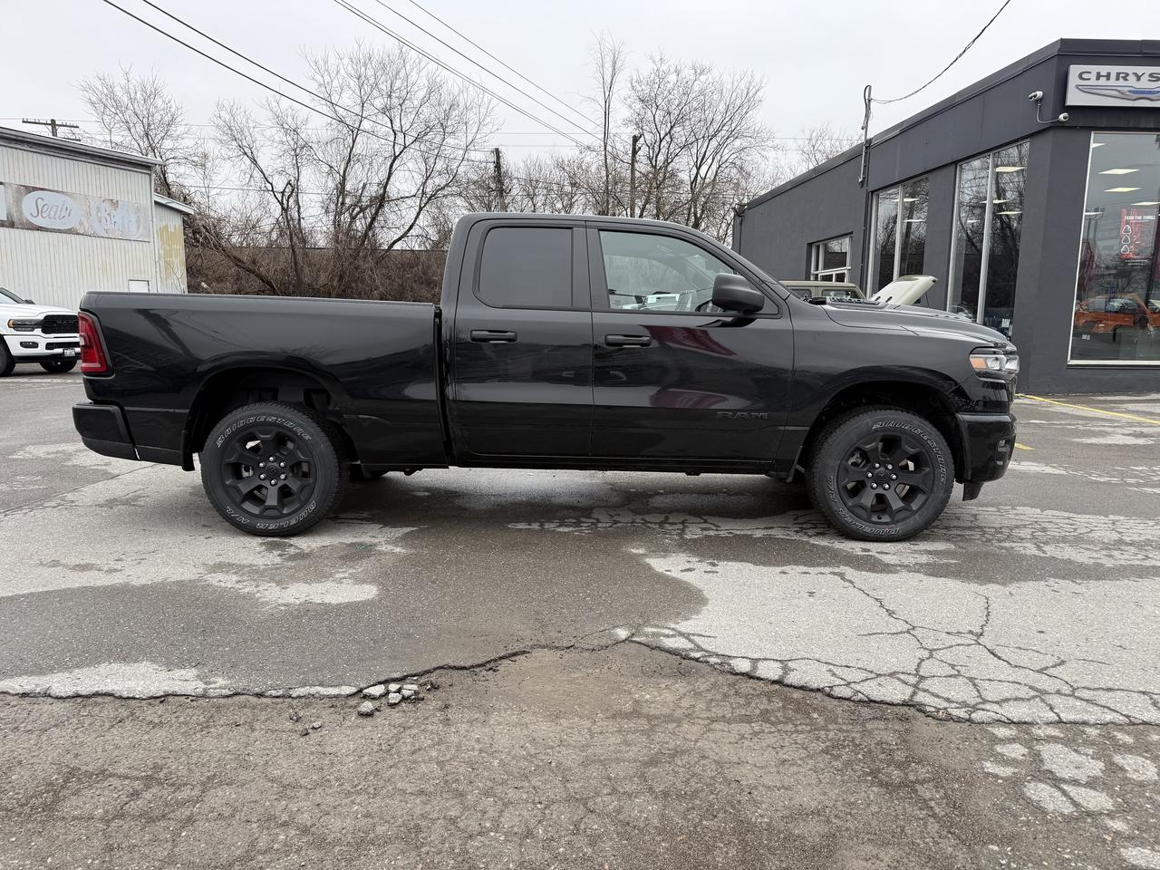 2026 RAM 1500 Black Express 4x4 Quad Cab 6'4  Box Photo