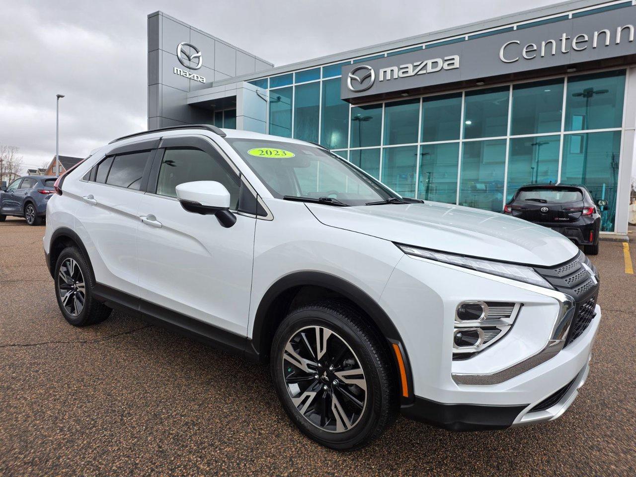 <span>The 2023 Mitsubishi Eclipse Cross SEL is a versatile and practical crossover SUV that comes standard with all-wheel control, providing excellent traction and stability in any weather conditions. Its powered by a 1.5L turbocharged 4-cylinder engine that produces 152 horsepower and 184 lb-ft of torque. The exterior design displays a distinct Mitsubishi flavour, featuring LED running lights, 18-inch alloy wheels, and edgy dynamics.</span>




<span>Inside, the Eclipse Cross offers a comfortable and spacious cabin. As an Eclipse Cross SE, its also a very premium cabin. Theres upmarket gear such blind spot monitoring, auto high beams, a heated steering wheel, and proximity access with pushbutton start. Other key upgrades include dual-zone automatic climate control, LED fog lights, and rain-sensing wipers. Theres more standard running gear, including an 8-inch centre screen with Apple CarPlay/Android Auto, heated front seats, satellite radio compatibility, 18-inch alloys, and rear cross-traffic alert.</span>




Thank you for your interest in this vehicle. Its located at Centennial Mazda, 402 Mt. Edward Road, Charlottetown, PEI. We look forward to hearing from you &ndash; call us toll-free at 1-902-894-8593.