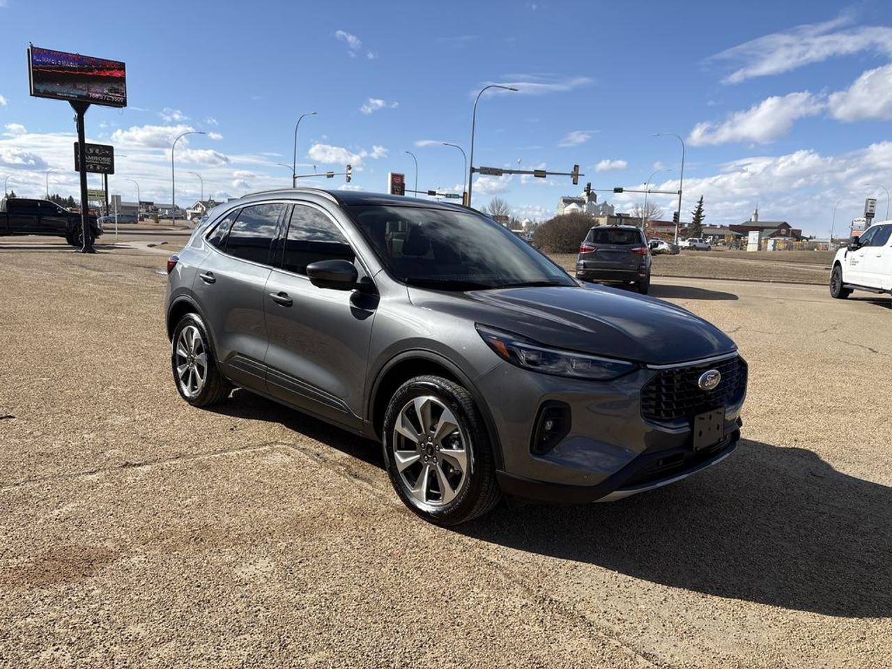 THE PRICE YOU SEE, PLUS GST. GUARANTEED!APPLE CARPLAY/ANDROID AUTO COMPATABLE! 2.0 LITER ECOBOOST, 8 SPEED AUTO, PLATINUM TRIM(601a), EBONY ACTIVE-X QUILTED SEATS, HEATED FRONT SEATS, HEATED STEERING WHEEL, PANORAMIC VISTA ROOF, 10 SPEAKER B&O AUDIO, 360 CAMERA W/ SPLIT VIEW, CLASS II TRAILER TOW PKG, HEADS-UP DISPLAY, SYNC 4.       The 2025 Ford Escape Platinum with the 601A package, the Premium Technology Package, and the 2.0-liter engine is a highly equipped compact SUV designed for both luxury and advanced functionality. The Platinum trim signifies the top-tier model, offering a range of premium features such as upscale interior materials, leather upholstery, and sophisticated design elements. The 601A package typically includes essential and convenience features like a larger touchscreen infotainment system, premium audio, enhanced connectivity options, and additional driver-assistance technologies. The Premium Technology Package further elevates the vehicle with advanced driver aids such as adaptive cruise control, lane-keeping assist, and a 360-degree camera system, along with upgraded navigation and a premium sound system. Under the hood, the 2.0-liter turbocharged four-cylinder engine delivers a balance of spirited performance and efficiency, providing ample power for daily driving while maintaining good fuel economy. Overall, the 2025 Ford Escape Platinum with these packages is a luxurious, tech-rich SUV that emphasizes comfort, safety, and performance, making it an appealing choice for those seeking a versatile and refined compact vehicle.Do you want to know more about this vehicle, CALL, CLICK OR COME ON IN!*AMVIC Licensed Dealer; CarFax and Full Mechanical Inspection Included.