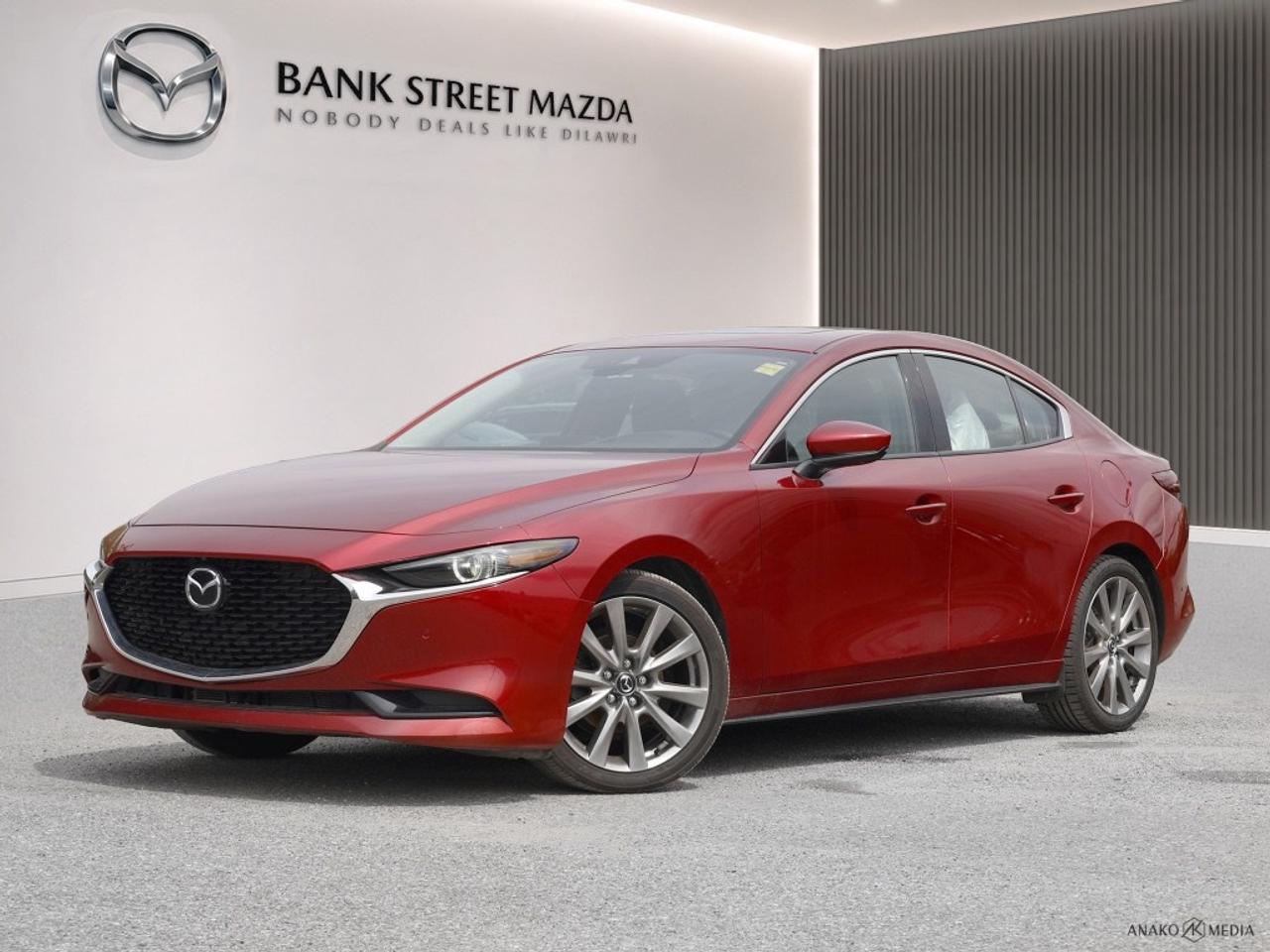Experience driving at its finest in the 2021 Mazda Mazda3 GT, a vibrant Red Sedan featuring front-wheel drive for responsive handling and smooth driving dynamics. The exterior showcases a bold design complemented by sleek alloy wheels and a sunroof that lets in natural light. Inside, step into a luxurious cabin with leather seats and a heated steering wheel that promises comfort even on the chilliest days. The sophisticated styling continues with a leather-wrapped gear shifter and smart cargo solutions for those on-the-go days. For technology enthusiasts, the Mazda3 GT offers a host of advanced features including a large screen navigation system, smart device integration for your tunes and apps, and a satellite radio for endless entertainment options. Safety is paramount with lane assist, adaptive cruise control, and a host of other driver assistance technologies, including a backup camera, ensuring confidence on every journey. This vehicle is perfect for both city commuters and enthusiasts who appreciate style and tech-savvy features. Contact our dealership today to learn more about the Mazda3 GT and to schedule your test drive!