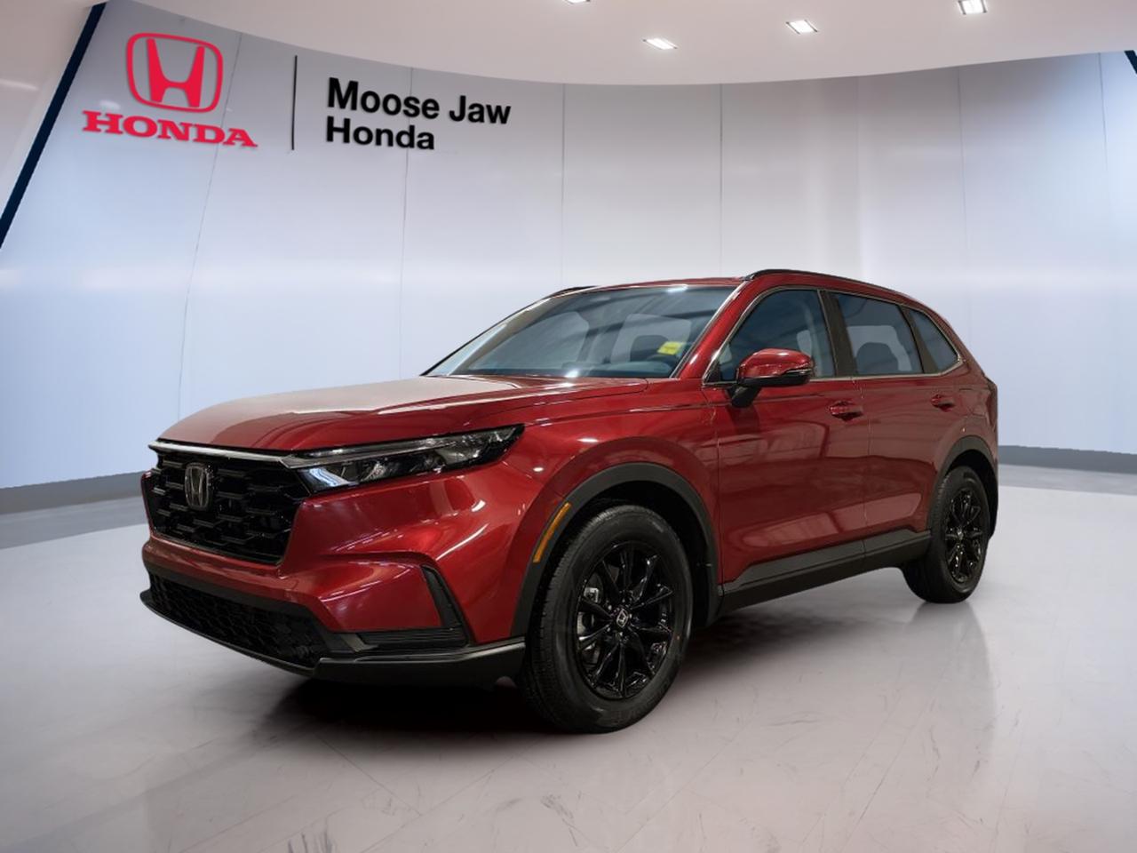 Meet the brand new 2026 Honda CR-V Sport, now at Moose Jaw Honda in Moose Jaw. This popular SUV blends smart design, strong everyday utility, and confident all-weather capability. Finished in red with a black interior, it brings a clean, modern look and the versatility many Canadian drivers want.

Built for daily life, the 2026 Honda CR-V Sport gives you the comfort of a roomy cabin, the confidence of all-wheel drive, and the smooth response of a continuously variable transmission. Its turbocharged 1.5-litre 4-cylinder engine delivers a balanced mix of power and efficiency for commuting, errands, and highway travel.

FEATURES OF THE CR-V Sport

»» Sport styling with bold SUV presence
»» Standard all-wheel drive for added confidence
»» Turbocharged engine for responsive daily driving
»» Spacious cabin with flexible utility

ADVANCED SAFETY FEATURES

»» Advanced airbag system for occupant protection
»» Vehicle Stability Assist helps maintain control
»» Anti-lock brakes support steady stopping power
»» Tire Pressure Monitoring System adds awareness

PERFORMANCE AND EFFICIENCY

»» 1.5-litre turbocharged four-cylinder engine delivers power
»» Continuously variable transmission supports smooth acceleration
»» All-wheel drive improves year-round traction
»» Efficient design helps reduce fuel use

COMFORT AND CONVENIENCE

»» Spacious interior supports daily family comfort
»» Four-door access makes entry very easy
»» Black interior offers a clean look
»» Versatile layout supports passengers and gear

TECHNONOLGY AND CONNECTIVITY

»» Clear driver information display aids awareness
»» Simple controls support easy daily use
»» Modern cabin layout feels intuitive
»» Smart design keeps essentials close

CARGO SPACE

»» Rear cargo area suits daily hauling
»» Wide opening helps load larger items
»» Flexible storage supports active lifestyles
»» SUV practicality fits errands and trips

WHAT OTHER OWNERS LIKE

»» Comfortable ride quality for daily driving
»» Useful cargo space for family needs
»» Confident all-wheel drive in poor weather
»» Strong balance of power and efficiency

The 2026 Honda CR-V Sport is a smart choice for drivers who need a compact SUV that feels ready for every season. In Moose Jaw, all-wheel drive can make a real difference, and this Honda CR-V Sport is equipped to help you handle changing road conditions with added confidence.

Its turbocharged engine gives the 2026 Honda CR-V Sport a lively feel in city traffic and on the open road. The continuously variable transmission helps keep acceleration smooth and efficient, making this SUV easy to drive whether you are heading across town or out on the highway.

Inside, the 2026 Honda CR-V Sport offers a roomy environment with practical space for people and cargo. The black interior gives the cabin a refined appearance, while the flexible layout helps you adapt to shopping trips, sports gear, work bags, or weekend travel with ease.

For drivers shopping new at Moose Jaw Honda, the 2026 Honda CR-V Sport stands out with trusted Honda engineering, everyday usefulness, and a design that suits modern life. It is a well-rounded SUV that delivers comfort, traction, efficiency, and style in one practical package.

This 2026 Honda CR-V Sports VIN is: 2HKRS4H53TH110086.