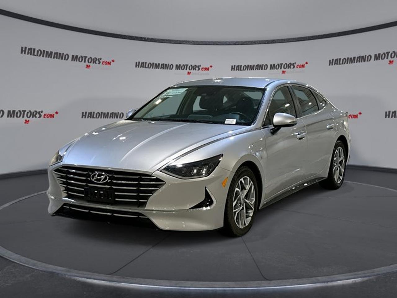 // ACCIDENT FREE!! //<br \><br \>This 2021 Hyundai Sonata Preferred 2WD is a smart midsize sedan with the style, comfort, and everyday value many drivers want. Offered by Haldimand Motors Ltd. in Cayuga, this used Hyundai stands out with its Silver exterior, Black interior, automatic transmission, and efficient 2.5-litre gas engine.<br \><br \>With 91,218 km on the odometer, this 4-door sedan is well equipped for commuting, family travel, and weekend drives. The 2021 Hyundai Sonata Preferred 2WD brings together useful technology, strong safety confidence, and cold-weather comfort, including a heated steering wheel, heated front seats, and remote starter.<br \><br \>FEATURES OF THE Sonata Preferred 2WD | No accidents | Heated Steering Wheel<br \>   Heated steering wheel for winter comfort<br \>   Heated front seats add daily comfort<br \>   Apple CarPlay and Android Auto included<br \>   Adaptive cruise control supports highway driving<br \><br \>ADVANCED SAFETY FEATURES<br \>   Backup camera helps with reverse visibility<br \>   Blind spot monitor adds lane awareness<br \>   Lane departure warning supports safer travel<br \>   Side and head airbags add protection<br \><br \>The 2021 Hyundai Sonata Preferred 2WD gives you reassuring driver-assist features and key protective systems for daily peace of mind. Anti-Lock Braking System, stability control, child safety locks, tire pressure monitoring, and multiple airbags help support confidence behind the wheel in changing road conditions.<br \><br \>PERFORMANCE AND EFFICIENCY<br \>   2.5-litre gas engine balances power efficiency<br \>   8-speed automatic delivers smooth shifting<br \>   Front-wheel drive supports all-season confidence<br \>   Dual shift mode adds driver control<br \><br \>This 2021 Hyundai Sonata Preferred 2WD is tuned for smooth, refined driving. Its 2.5-litre engine offers solid everyday performance, while the 8-speed automatic transmission helps keep acceleration responsive and highway cruising relaxed. Power steering and adaptive cruise control make longer drives easier and more enjoyable.<br \><br \>COMFORT AND CONVENIENCE<br \>   Heated front seats improve cold mornings<br \>   Remote starter warms cabin before driving<br \>   Front air conditioning keeps cabin comfortable<br \>   Push button start adds easy access<br \><br \>Inside, the 2021 Hyundai Sonata Preferred 2WD is built for comfort and simple operation. The cabin includes an adjustable steering wheel, leather-wrapped steering wheel, power windows, automatic door locks, remote trunk release, rear trunk access, and ambient lighting package for a more inviting feel.<br \><br \>TECHNONOLGY AND CONNECTIVITY<br \>   Apple CarPlay connects your favourite apps<br \>   Android Auto keeps smartphone access simple<br \>   Bluetooth integration supports hands-free communication<br \>   HD Radio adds clear audio entertainment<br \><br \>The 2021 Hyundai Sonata Preferred 2WD makes it easy to stay connected on the road. Steering wheel audio controls keep key functions close at hand, while Bluetooth integration, Apple CarPlay, and Android Auto help you manage calls, music, messages, and navigation with less distraction.<br \><br \>CARGO SPACE<br \>   Rear trunk access makes loading easier<br \>   Sedan trunk suits daily gear well<br \>   Four doors improve passenger entry ease<br \>   Spare tire adds practical reassurance<br \><br \>This 2021 Hyundai Sonata Preferred 2WD offers the practical trunk space midsize sedan shoppers appreciate. It is well suited for groceries, work bags, sports gear, and travel essentials, while the wide trunk opening helps make loading and unloading simple during busy daily use.<br \><br \>AWARDS & RECOGNITIONS<br \>   Top Safety Pick, Insurance Institute for Highway Safety, 2021<br \><br \>WHAT OTHER OWNERS LIKE<br \>   Smooth ride quality on daily drives<br \>   User-friendly infotainment and smartphone integration<br \>   Comfortable cabin with useful features<br \>   Strong value for a midsize sedan<br \><br \>Drivers often praise the 2021 Hyundai Sonata Preferred 2WD for its easy road manners, thoughtful technology, and comfortable layout. Its blend of efficiency, safety features, and practical convenience makes it a compelling choice for drivers who want a modern sedan that feels ready for Canadian driving.<br \><br \>This 2021 Hyundai Sonata Preferred 2WD | No accidents | Heated Steering Wheels VIN is: 5NPEG4JAXMH132160.<br \><br \>WHY CHOOSE US? <br \><br \>Honest & Transparent Buying Experience: Weve been a trusted name in business since 1984.<br \><br \>STRAIGHTFORWARD PRICING:<br \>Our Advertised Price Includes:<br \>>>Safety Certification (No separate fee!)<br \>>>30-Day 100% Mechanical Warranty<br \>>>FREE Carfax History Report.<br \>>>No upcharge for paying cash.<br \>(Prices Exclude HST and Licensing Fees only.)<br \><br \>>>Browse 300+ vehicles all in ONE LOCATION<br \><br \>EASY FINANCING: Great rates & open loans<br \><br \>WE BUY CARS: Get Top Dollar for your trade-in, or sell us your vehicle for CASH! Even if you dont buy from us!<br \><br \>STOP BY TODAY<br \>Treat yourself - stop by Haldimand Motors Ltd. located at 42 Talbot St E, Cayuga, ON N0A 1E0 to make this car yours today!<br \><br \>https://www.haldimandmotors.com/used/stock-460331.html