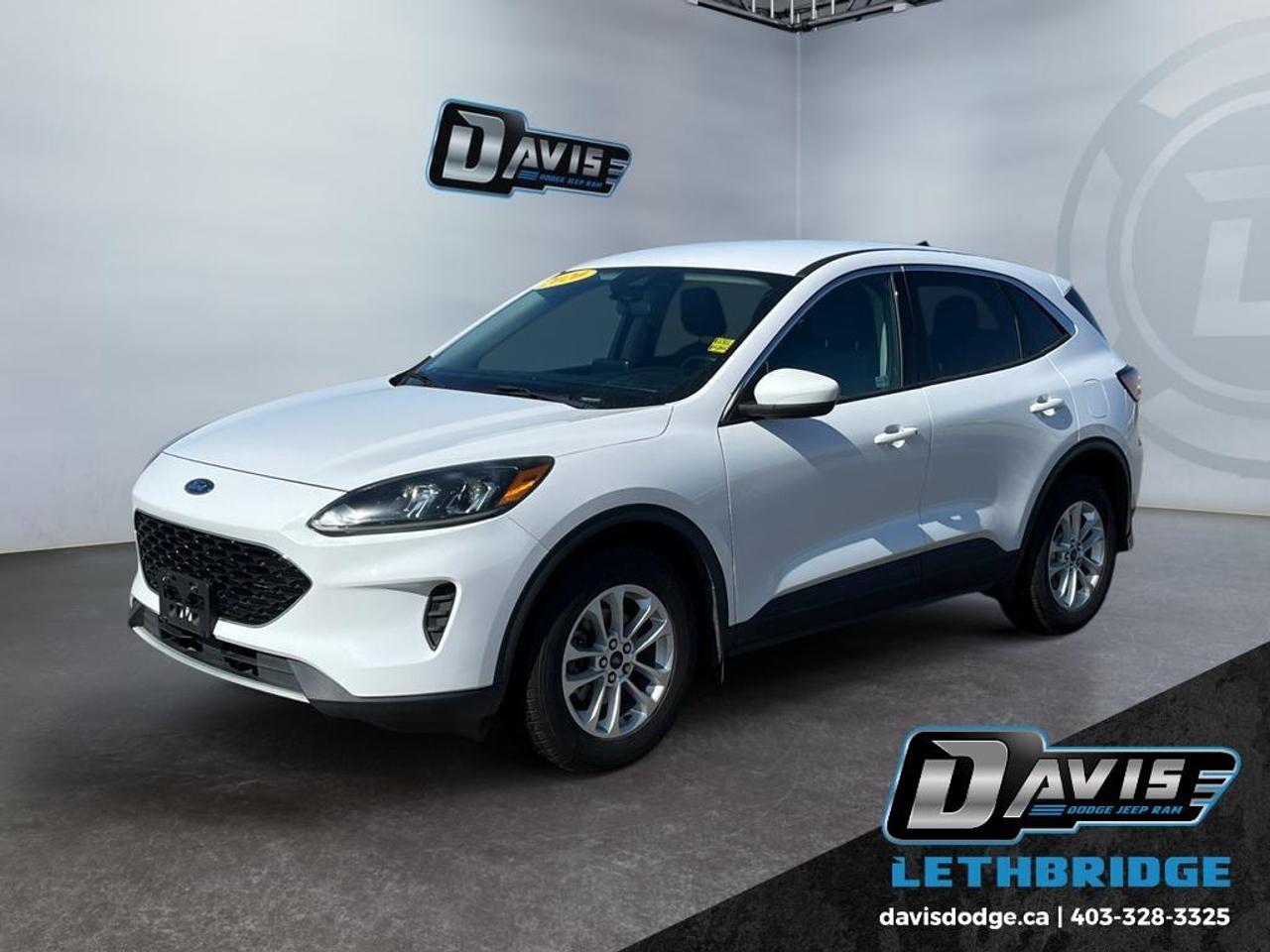<b>Heated Seats, Aluminum Wheels, Android Auto, Apple CarPlay, Ford Co-Pilot360!<br /> <br /></b><br /> The 2020 Ford Escape SE is a versatile and efficient compact SUV, powered by a responsive 1.5L EcoBoost engine paired with a smooth 8-speed automatic transmission. This combination delivers an excellent balance of performance and fuel economy, making it ideal for daily commuting and long-distance driving. With its modern design and comfortable interior, the Escape offers both practicality and style.<br /><br />Equipped with Ford Co-Pilot360 Assist, this Escape SE enhances confidence on the road with advanced safety features including Adaptive Cruise Control, Blind Spot Monitoring, Lane Keeping System, and Pre-Collision Assist. These intelligent technologies work together to help keep you aware of your surroundings and protected during every drive.<br /><br />Inside, youll find convenient features like heated front seats, keyless entry, and a reverse backup camera for added comfort and ease of use. With its efficient turbocharged engine, advanced safety systems, and user-friendly technology, the 2020 Ford Escape SE is a smart choice for drivers seeking reliability and everyday versatility.<br /> <br />To apply right now for financing use this link: <a href=https://lethbridge.davisdodge.ca/free-credit-check/ target=_blank rel=nofollow noopener noreferrer>https://lethbridge.davisdodge.ca/free-credit-check/</a><br /> <br /><br />Locally Owned & Trusted for Over 35 Years  Davis Dodge in Lethbridge, AB <br /><br /> At Davis Dodge, weve proudly served the Lethbridge community for more than 35 years, offering an unparalleled car buying experience. Dont just take our word for itour Google reviews speak volumes about our commitment to exceptional service. <br /><br /> Delivery & At-Home Test Drives: Convenient options to suit your lifestyle. <br /><br /> Flexible Financing for Everyone: Get the vehicle you need with financing solutions tailored to your situation. <br /><br /> Full Mechanical Inspections & Professional Cleaning: Every vehicle is thoroughly inspected and cleaned before it hits our lot.<br /><br /> We take all makes and models on trade and offer competitive pricing with inventory that changes daily. Whether you're shopping for a Chrysler, Dodge, Jeep, RAM, or FIAT, our AMVIC Licensed dealership makes it easy to browse, buy, and drive away.<br /><br /> Located in Lethbridge, AB, we proudly serve customers in Fort Macleod, Taber, Claresholm, and Coaldale. Shop online or visit us today to experience the best in sales, service, and selection. Standard bank rates apply; taxes are additional.<br /><br /> Vehicle pricing offer shown expires 2026-05-31. <br /> Come by and check out our fleet of 60+ used cars and trucks and 110+ new cars and trucks for sale in Lethbridge. o~o