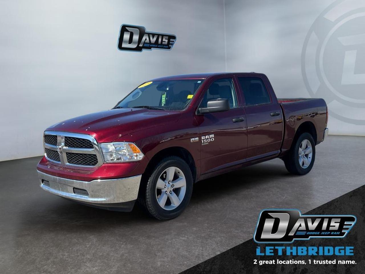 <b>Aluminum Wheels, Proximity Key, Heavy Duty Suspension, Power Mirrors, Rear Camera!</b><br /> <br /> Reliable, dependable, and innovative, this Ram 1500 Classic proves that it has what it takes to get the job done right. This 2023 Ram 1500 Classic is fresh on our lot in Lethbridge. <br /> <br />The reasons why this Ram 1500 Classic stands above its well-respected competition are evident: uncompromising capability, proven commitment to safety and security, and state-of-the-art technology. From its muscular exterior to the well-trimmed interior, this 2023 Ram 1500 Classic is more than just a workhorse. Get the job done in comfort and style while getting a great value with this amazing full-size truck. This Crew Cab 4X4 pickup has 79,990 km. Stock number 41408 is Red in colour. It has an Automatic transmission and is powered by a 395HP 5.7L 8 Cylinder Engine. <br /> <br /> Our 1500 Classic's trim level is SLT. This Ram 1500 SLT steps things up with upgraded aluminum wheels, proximity keyless entry, USB connectivity and exterior chrome styling, along with a great selection of standard features such as a wiring harness, , heavy-duty suspension, cargo box lighting, and a locking tailgate. Additional features include heated and power adjustable side mirrors, UCconnect 3, cruise control, air conditioning, vinyl floor lining, and a rearview camera. This vehicle has been upgraded with the following features: Aluminum Wheels, Proximity Key, Heavy Duty Suspension, Power Mirrors, Rear Camera.<br /> <br />To apply right now for financing use this link: <a href=https://lethbridge.davisdodge.ca/free-credit-check/ target=_blank rel=nofollow noopener noreferrer>https://lethbridge.davisdodge.ca/free-credit-check/</a><br /><br /> <br /><br />Locally Owned & Trusted for Over 35 Years  Davis Dodge in Lethbridge, AB <br /><br /> At Davis Dodge, weve proudly served the Lethbridge community for more than 35 years, offering an unparalleled car buying experience. Dont just take our word for itour Google reviews speak volumes about our commitment to exceptional service. <br /><br /> Delivery & At-Home Test Drives: Convenient options to suit your lifestyle. <br /><br /> Flexible Financing for Everyone: Get the vehicle you need with financing solutions tailored to your situation. <br /><br /> Full Mechanical Inspections & Professional Cleaning: Every vehicle is thoroughly inspected and cleaned before it hits our lot.<br /><br /> We take all makes and models on trade and offer competitive pricing with inventory that changes daily. Whether you're shopping for a Chrysler, Dodge, Jeep, RAM, or FIAT, our AMVIC Licensed dealership makes it easy to browse, buy, and drive away.<br /><br /> Located in Lethbridge, AB, we proudly serve customers in Fort Macleod, Taber, Claresholm, and Coaldale. Shop online or visit us today to experience the best in sales, service, and selection. Standard bank rates apply; taxes are additional.<br /><br /> Vehicle pricing offer shown expires 2026-04-30. <br /> Come by and check out our fleet of 80+ used cars and trucks and 100+ new cars and trucks for sale in Lethbridge. o~o
