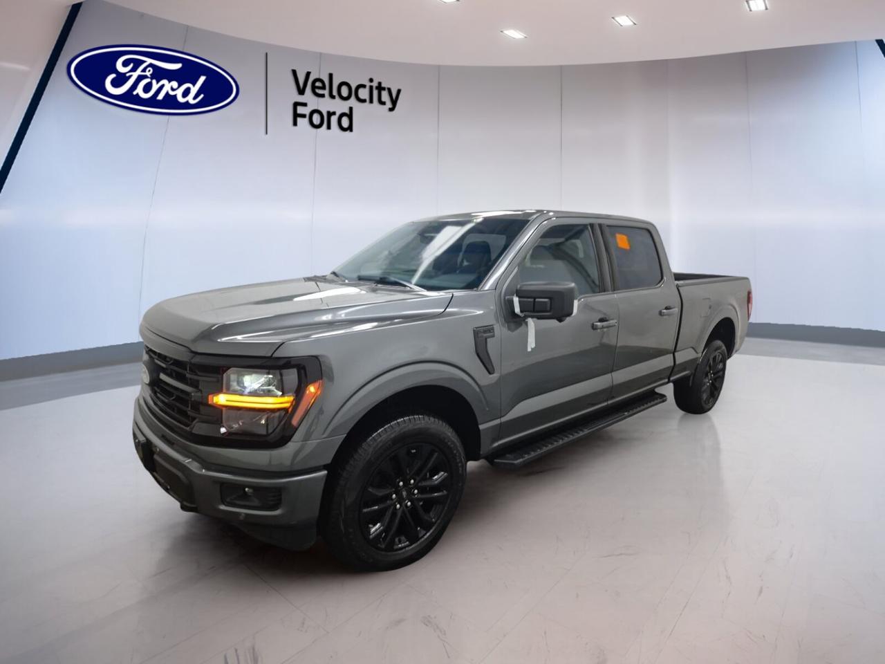 Built for hard work and daily comfort, this used 2025 Ford F-150 XLT 4WD SuperCrew 6.5 Box is ready for life in Moose Jaw. It has a Grey exterior, a Black interior, four doors, an automatic transmission, and a 3.5-litre unleaded engine. With only 5,964 km, this truck gives you modern capability, proven Ford toughness, and the confidence of a well-equipped full-size pickup from Velocity Ford.

The roomy cab and long 6.5-foot box make this 2025 Ford F-150 XLT 4WD SuperCrew 6.5 Box a smart fit for work, family use, and weekend hauling. Four-wheel drive adds year-round traction, while off-road tires, chrome wheels, LED headlamps, and fog lights give it a clean, capable look. This truck also offers a strong towing capacity of 4,626 kg.

FEATURES OF THE F-150 XLT 4WD SuperCrew 6.5 Box
»» Spacious SuperCrew cab with four full doors
»» Long 6.5-foot box adds hauling flexibility
»» XLT trim balances value and utility
»» Four-wheel drive supports year-round confidence

TRUCK FEATURES
»» Tows up to 4,626 kg with confidence
»» Rear tow hook supports recovery situations
»» Off-road tires aid rough surface traction
»» Long cargo box handles larger loads

ADVANCED SAFETY FEATURES
»» Backup camera helps with reversing visibility
»» Blind spot monitor adds lane-change awareness
»» Lane departure warning supports safer travel
»» Side and head airbags enhance protection

PERFORMANCE AND EFFICIENCY
»» 3.5-litre unleaded engine delivers strong output
»» Automatic transmission shifts smoothly every day
»» Dual shift mode adds manual control
»» Four-wheel drive improves grip on roads

COMFORT AND CONVENIENCE
»» Cruise control supports relaxed highway driving
»» Front air conditioning keeps cabin comfortable
»» Power windows add everyday convenience
»» Driver lumbar support boosts seat comfort

TECHNONOLGY AND CONNECTIVITY
»» Bluetooth integration supports hands-free calling
»» WiFi hotspot keeps devices connected
»» Satellite radio expands entertainment choices
»» Steering wheel audio controls ease use

CARGO SPACE
»» 6.5-foot box supports bigger gear loads
»» Rear trunk access aids cargo handling
»» Spare tire adds peace of mind
»» Four-door cab offers flexible storage options

WHAT OTHER OWNERS LIKE
»» Strong towing ability for work and play
»» Spacious cabin for passengers and gear
»» Confident four-wheel drive in poor weather
»» User-friendly tech for daily driving

This 2025 Ford F-150 XLT 4WD SuperCrew 6.5 Boxs VIN is: 1FTFW3L83SKF59500.
