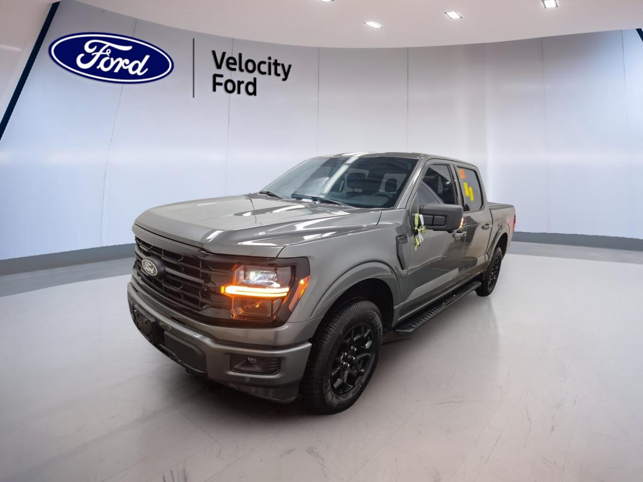 // ACCIDENT FREE!! //
// SINGLE OWNER! //

This 2024 Ford F-150 XLT 4WD 5.5 Box COMING SOON is a smart full-size truck for work and daily life in Moose Jaw. CARFAX Canada reports no accident, and it has had a single owner. With 75,898 km, a grey exterior, black interior, automatic transmission, and 2.7-litre unleaded engine, it is ready to deliver strong everyday capability.

Built to handle changing road and weather conditions, this used Ford offers Four-Wheel Drive, off-road tires, and a useful 5.5-foot box. The four-door cabin adds easy access for passengers, while practical comfort and modern tech help make every drive more enjoyable. It is also rated to tow up to 4,671 kg.

FEATURES OF THE F-150 XLT 4WD 5.5 Box COMING SOON
»» Grey exterior with bold truck presence
»» 2.7-litre unleaded engine with 4WD
»» Automatic transmission for smooth daily driving
»» 4-door cab with practical versatility

TRUCK FEATURES
»» Towing capacity rated at 4,671 kg
»» Rear tow hook adds useful utility
»» Box access supports easy cargo loading
»» Steps help cabin entry and exit

ADVANCED SAFETY FEATURES
»» Backup camera helps with reversing confidence
»» Blind spot monitor adds lane awareness
»» Lane departure warning supports safer travel
»» Side and head airbags enhance protection

PERFORMANCE AND EFFICIENCY
»» 2.7-litre engine balances power and efficiency
»» Four-Wheel Drive improves year-round traction
»» Automatic transmission delivers smooth shifting response
»» Stability control supports confident road handling

COMFORT AND CONVENIENCE
»» Dual-zone climate control adds cabin comfort
»» Driver power seat supports easy adjustment
»» Passenger lumbar support improves ride comfort
»» Heated mirrors help in cold weather

TECHNONOLGY AND CONNECTIVITY
»» Navigation system helps guide every trip
»» Bluetooth integration supports hands-free communication
»» WiFi hotspot keeps devices better connected
»» Satellite radio expands in-cabin entertainment choices

CARGO SPACE
»» 5.5-foot box handles daily hauling needs
»» Rear trunk access aids cargo reach
»» Four-door layout supports cabin flexibility
»» Spare tire adds practical roadside support

WHAT OTHER OWNERS LIKE
»» Strong towing ability for work and play
»» Comfortable ride for a full-size truck
»» Useful technology that feels easy to use
»» Confident traction in changing road conditions

This 2024 Ford F-150 XLT 4WD 5.5 Box COMING SOON gives you the strength expected from a Ford truck with practical features that matter every day. Cruise control, power steering, ABS, power windows, fog lights, LED headlamps, tinted windows, chrome wheels, and steering wheel audio controls help round out a well-equipped pickup.

At Velocity Ford in Moose Jaw, this accident-free, single-owner F-150 stands out for its honest history and useful equipment. From jobsite tasks to weekend towing, it offers the capability, comfort, and connected features many Canadian drivers want in a modern full-size truck.

This 2024 Ford F-150 XLT 4WD 5.5 Box COMING SOONs VIN is: 1FTEW3LP8RKD09733.