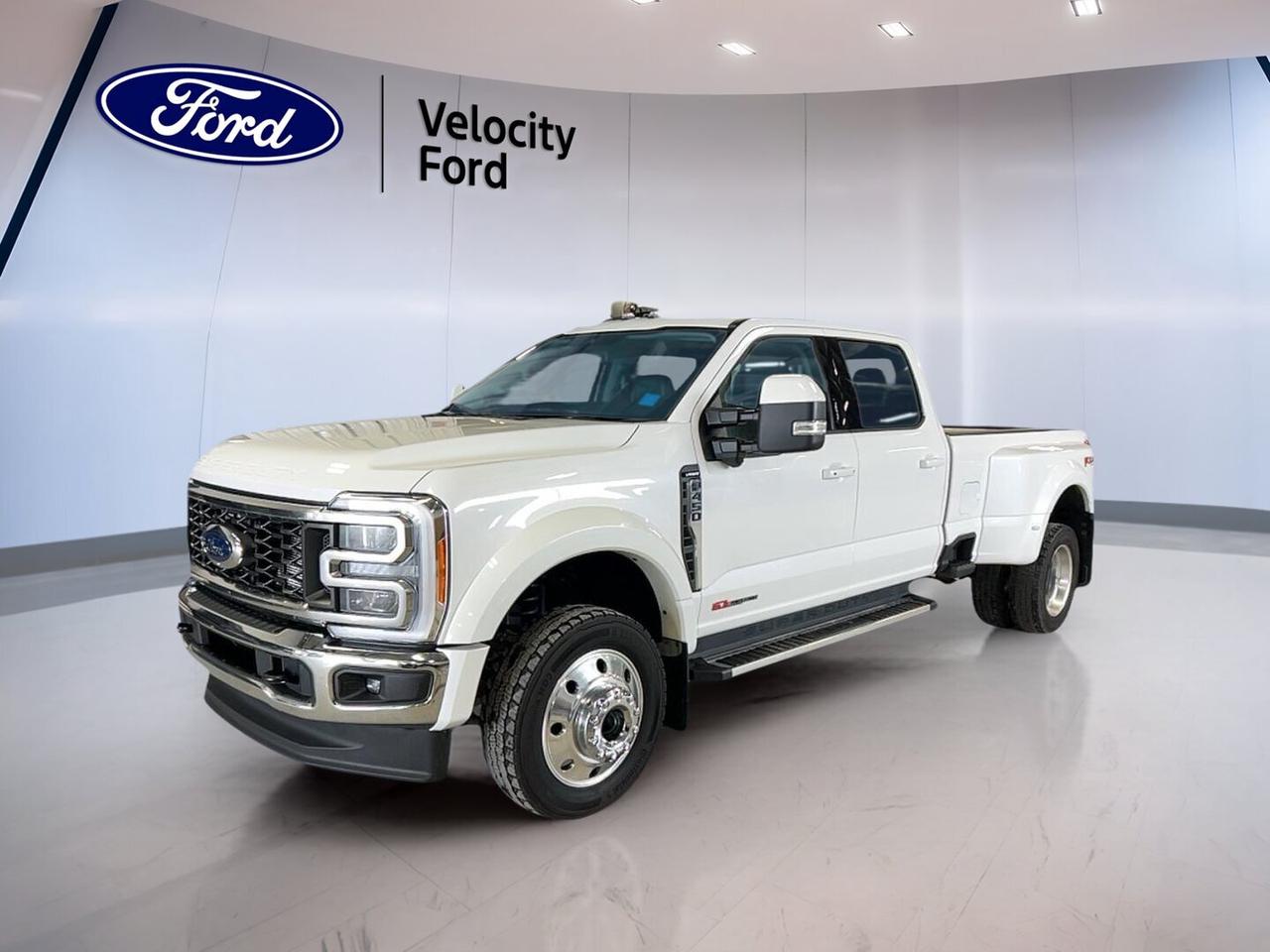 Built for serious work and long-haul confidence, this used 2023 Ford Super Duty F-450 DRW LARIAT 4WD Crew Cab 8 Box delivers the heavy-duty strength truck buyers demand. Sold by Velocity Ford in Moose Jaw, it pairs a White exterior with a Black interior, four full doors, automatic transmission, and a 6.7-litre diesel engine.

With 102,483 km on the odometer, this Ford Super Duty F-450 DRW LARIAT 4WD Crew Cab 8 Box is ready for demanding jobs, towing duty, and daily use. Its dual rear wheels, four-wheel drive, and factory-equipped towing capability of 13,605 kg make it a strong fit for commercial hauling or large trailer work.

FEATURES OF THE Super Duty F-450 DRW LARIAT 4WD Crew Cab 8 Box

»» 6.7-litre diesel power for heavy hauling
»» Crew Cab adds roomy passenger space
»» Dual rear wheels improve load stability
»» Four-wheel drive boosts traction year-round

TRUCK FEATURES

»» Towing capacity rated at 13,605 kg
»» Dual rear wheels support heavy loads
»» Rear tow hook adds work-ready utility
»» Side steps ease cab entry

ADVANCED SAFETY FEATURES

»» Backup camera helps when reversing carefully
»» Blind Spot Monitor adds lane-change confidence
»» Side impact airbags enhance occupant protection
»» Stability Control supports secure handling

PERFORMANCE AND EFFICIENCY

»» Automatic transmission delivers smooth power changes
»» Limited slip differential aids traction
»» Four-wheel drive handles rough conditions
»» Diesel engine supports strong towing performance

COMFORT AND CONVENIENCE

»» Heated front seats add cold-weather comfort
»» Heated rear seats help passengers relax
»» Dual-zone climate control manages cabin temperature
»» Remote starter adds everyday convenience

TECHNONOLGY AND CONNECTIVITY

»» Navigation system helps guide each trip
»» Bluetooth integration supports hands-free calling
»» WiFi hotspot keeps devices connected
»» Steering wheel audio controls simplify access

CARGO SPACE

»» Eight-foot box supports large cargo needs
»» Crew Cab balances passengers and gear
»» Rear trunk access aids item loading
»» Spare tire adds worksite peace

WHAT OTHER OWNERS LIKE

»» Strong diesel towing power for big jobs
»» Spacious Crew Cab for family use
»» Comfortable heated seats in winter
»» Stable dual rear wheel confidence

This truck also includes practical features that add value every day. You get cruise control, power steering, anti-lock braking system, child safety locks, heated mirrors, electric mirrors, power windows, automatic headlights, fog lights, tinted windows, adjustable pedals, push button start, retractable mirrors, turn signal mirrors, and a rear window defroster.

Inside, the cabin is set up for comfort and ease of use. This Ford Super Duty F-450 DRW LARIAT 4WD Crew Cab 8 Box includes memory seats, a power drivers seat, power passenger seat, driver and passenger lumbar support, automatic climate control, ambient lighting package, auto-dimming rearview mirror, illuminated vanity mirrors, HD Radio, satellite radio, and LED headlamps.

This 2023 Ford Super Duty F-450 DRW LARIAT 4WD Crew Cab 8 Boxs VIN is: 1FT8W4DM1PED23332.