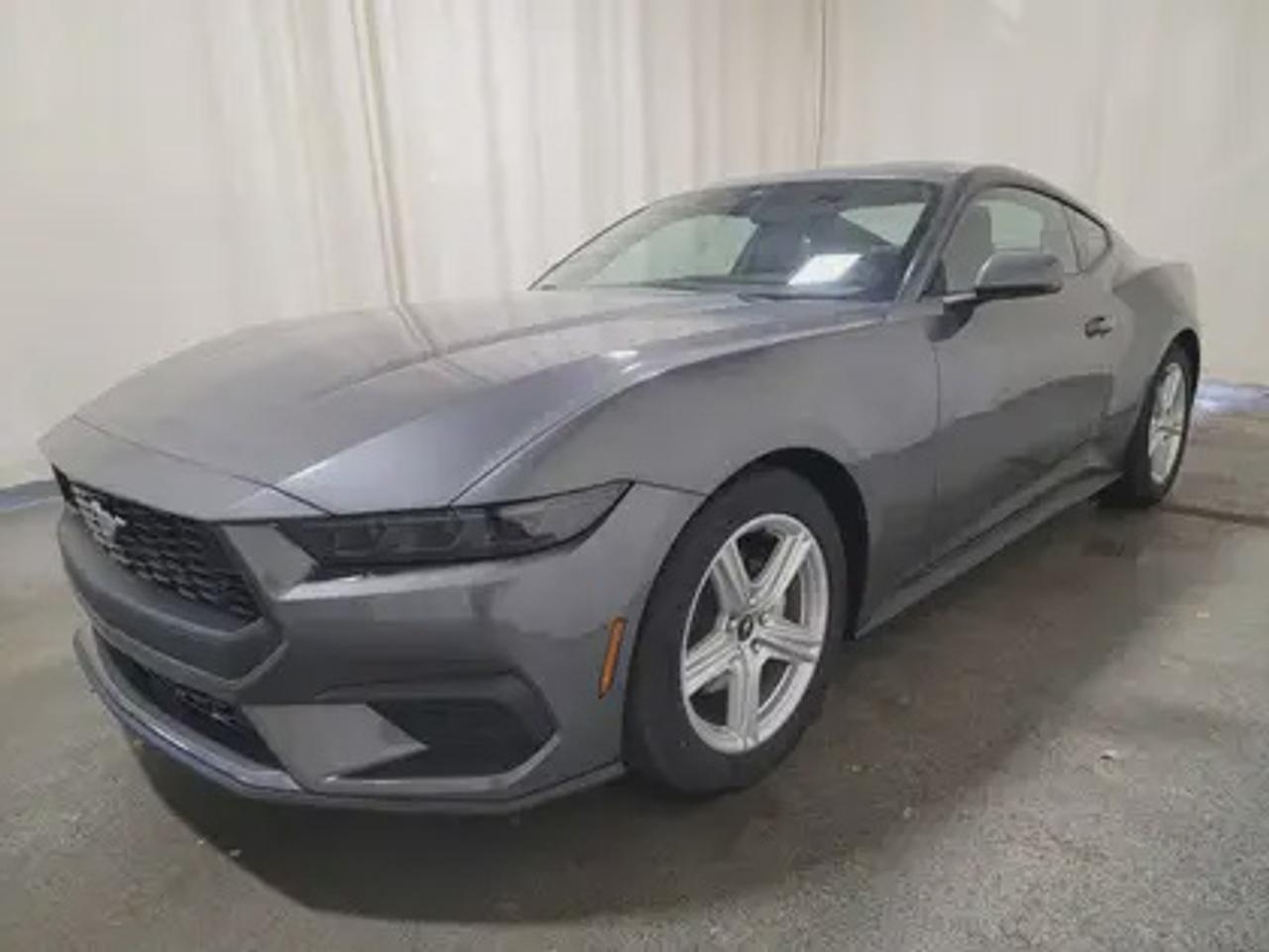 This new 2026 Ford Mustang EcoBoost Premium looks eye catching in the color Carbonized Grey Metallic. This fastback comes with the 2.3L EcoBoost engine which connects you to the road with this 10-speed automatic transmission. This popular engine produces 315 horsepower and 350 lb.-ft of torque.  

Key Features:
Ford Co-Pilot 360 Technology 
Lane Keep Assist 
Heated Steering Wheel
Rear View Camera 
Adaptive Cruise Control
Rain Sensing Wipers 
Rear Parking Sensors 
Ford Connectivity Package (1-year included)*
SYNC 4W/ 9 Speaker Stereo System
Wireless Apple Car Play/Android Auto Connection 
Leather Heated Seats
13.2 LCD Touchscreen
Pre- Collison Assist 
3.15 Limited Slip Axle 
Dual-Zone Climate Control 
6-Way Power Drivers Seat & 4-Way Power Passenger Seat

This vehicle comes with the All-Weather Packageready to take on any season!
Snow, rain, mud, or sunshinethis vehicle is built for it all! The All-Weather Package adds extra protection where it matters most, with premium mud flaps to shield your paint from road debris, all-weather floor mats to protect your interior from lifes messes, and Xpel paint protection to help guard against those infuriating rock chips. Drive with confidence, knowing your investment is protected from Reginas elements.
 
Bennett Dunlop Ford, proudly serving Regina for over 40 years, is conveniently located at 770 Broad Street. With over 3,500 Google reviews, our reputation reflects our commitment to providing a fast, easy, and enjoyable vehicle-buying experience. We eliminate the hassle with no admin or documentation fees, transparent upfront pricing that lets you shop with total confidence. But were more than just a dealershipwere driven to make a difference by supporting local community initiatives and events that matter to you. Visit Bennett Dunlop Ford today and experience why were Reginas trusted choice for quality vehicles, exceptional service, and a genuine commitment to driving change in our community!