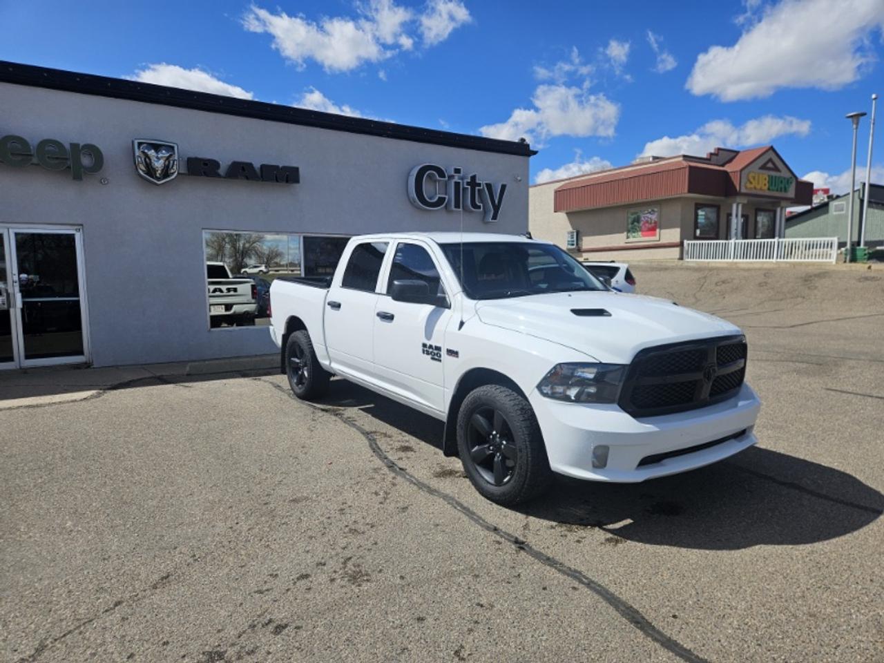 <p>The 2021 Ram 1500 Tradesman is a dependable and hard-working full-size pickup truck built to deliver proven HEMI performance rugged capability and everyday practicality. Powered by the legendary 5.7L HEMI V8 engine producing 395 horsepower this truck delivers strong towing capability confident acceleration and reliable performance whether on the highway at the job site or hauling equipment. Equipped with a capable 4x4 drivetrain the Ram 1500 Tradesman is ready to handle Alberta winters rough roads and demanding workloads with confidence.</p><p>The spacious Crew Cab configuration provides generous interior room for passengers and gear making it ideal for both work crews and family use. Its short box design offers the perfect balance between cargo versatility and easy maneuverability around town. Built with Ram&rsquos reputation for durability and comfort the 2021 Ram 1500 Tradesman combines practical functionality strong V8 performance and dependable capability into one well-rounded pickup truck.</p><p>City Chrysler holds a high standard of service &amp excellence for our customers. We are located on the northside of highway 3 of Medicine Hat. Servicing areas from Swift Current to Lethbridge Brooks &amp Taber. Our legacy is to make sure our customers feel right at home as well as taken care of in the highest priority. We are known for being down to earth super friendly and very knowledgeable. We provide excellent customer service and if you are tired of high-pressure sales then City Chrysler is for you. Check out our Google reviews because they tell our story. Then give us a call send us an email or stop by and let us get to work for you! Bankruptcies No credit Bad credit Slow credit Dont sweat it! Get preapproved today!</p>