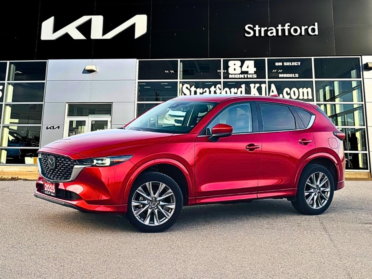 <b>Premium Audio,  Cooled Seats,  HUD,  Sunroof,  Climate Control!</b><br> <br> Stratford Kia Used Cars & Pre-Owned Superstore: We sell all makes and models.<br><br>Audi, Acura, Alfa Romeo, BMW, Buick, Cadillac, Chevrolet, Chrysler, Dodge, Ram, Ferrari, Ford, GMC, Genesis, Honda, Hyundai, Infiniti, Jaguar, Jeep, Kia, Lamborghini, Land Cruiser, Lexus, Lincoln, Land Rover, Maserati, Mazda, Mercedes AMG, Mercedes Benz, Mini, Mitsubishi, Nissan, Porsche, Ram, Subaru, Tesla, Toyota, Volkswagen, Volvo.<br> <br>This 2025 Mazda CX-5s dynamic handling and responsive steering stand out in a class that largely favors practicality over performance. This 2025 Mazda CX-5 is fresh on our lot in Stratford. <br> <br>This 2025 CX-5 strengthens the connection between vehicle and driver. Mazda designers and engineers carefully consider every element of the vehicles makeup to ensure that the CX-5 outperforms expectations and elevates the experience of driving. Powerful and precise, yet comfortable and connected, the 2025 CX-5 is purposefully designed for drivers, no matter what the conditions might be. This wagon has 54,447 km. Its Red Crystal Metallic in colour. It has an Automatic transmission and is powered by a 187HP 2.5L 4 Cylinder Engine. <br> <br> Our CX-5s trim level is GT. This trim steps things up with a power sunroof, a 10-speaker Bose Premium audio system, a power liftgate for rear cargo access, heated and ventilated front seats with a heated steering wheel, a drivers head up display, adaptive cruise control, dual-zone climate control, leather upholstery, adaptive cruise control, and a 10.25-inch infotainment screen with inbuilt navigation, Apple CarPlay and Android Auto. Safety features also include lane keep assist with lane departure warning, collision mitigation, and advanced blind spot monitoring. This vehicle has been upgraded with the following features: Premium Audio, Cooled Seats, HUD, Sunroof, Climate Control, Power Liftgate, Leather Seats.<br> <br>To apply right now for financing use this link: <a href=https://www.stratfordkia.com/credit-application/ target=_blank>https://www.stratfordkia.com/credit-application/</a><br><br> <br/><br>While every effort is made to ensure accuracy, we are not responsible for any errors and omissions. ***In-stock vehicle may differ from online listing— Please confirm details with dealerPlease see your dealer for current pricing. <br><br>Stratford Kia is a proud member of the Trinity Auto Group. Serving Stratford and South Western Ontario. We invite you to experience our unparalleled Customer Service and truly enjoy your Car Buying experience, the way it should be. WE NEED YOUR TRADE! We offer top market value for trade ins. We also offer a great selection of Pre-Owned Vehicles. Our second-to-none reconditioning process and attention to detail are why our customers know they can buy with confidence. Experience the Stratford Kia difference today! 863 Erie Street. Stratford Ont. N5A 6S4<br> Come by and check out our fleet of 40+ used cars and trucks and 80+ new cars and trucks for sale in Stratford.  o~o