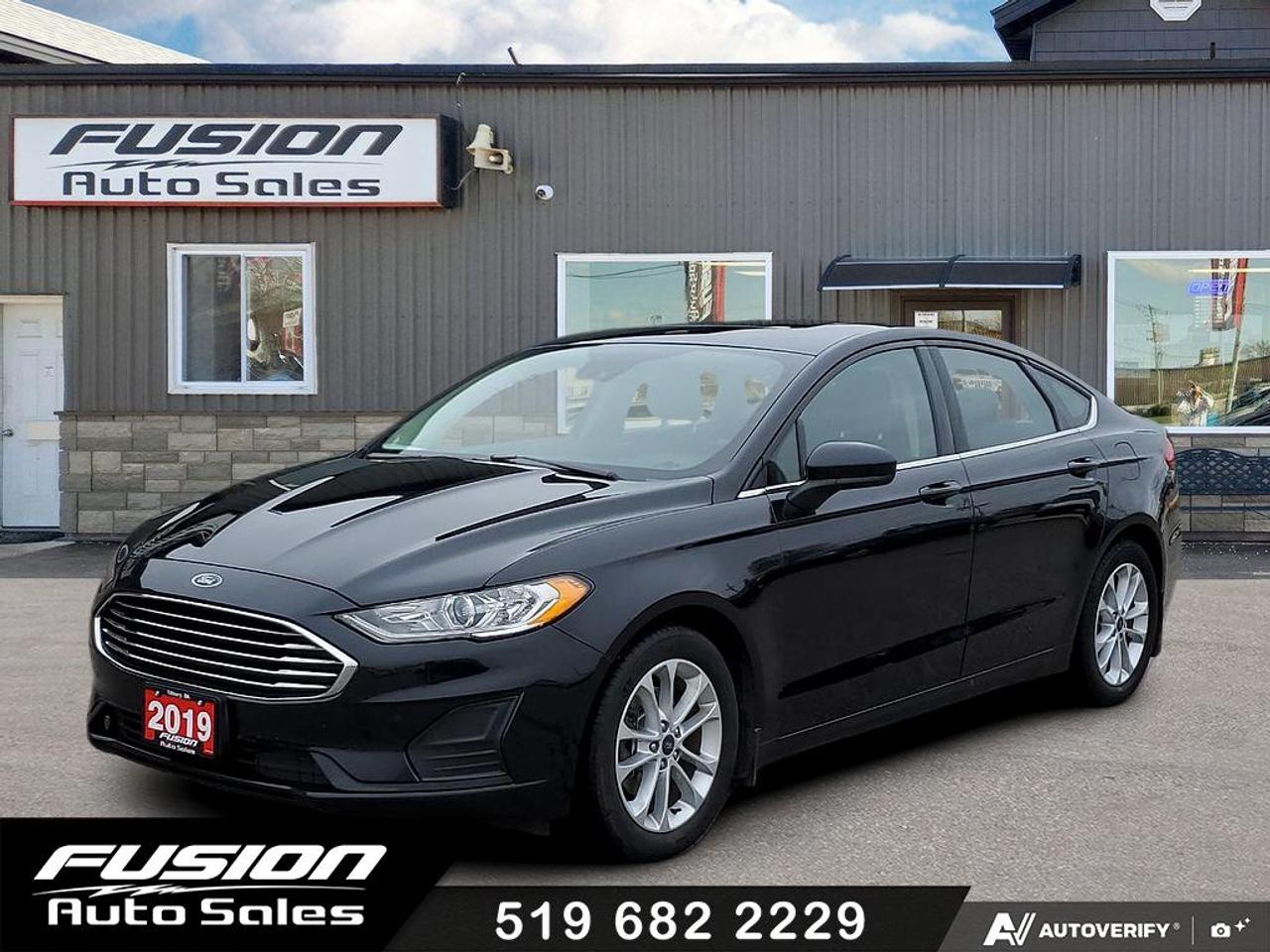 <p>1.5L 4Cyl EcoBoost, FWD, Auto, Power Sunroof with Sunshade, Navigation, Back Up Camera with Park distance control, Heated Seats, Alloy Wheels, Adaptive Cruise, Lane Assist, Blind Spot Detection, Collision Warning with Active Braking, and more. Lic & HST Extra.</p><p>Looking for a reliable and stylish sedan? Check out this sleek black 2019 Ford Fusion SE FWD, available now at Fusion Auto Sales! This well-maintained Fusion offers a comfortable and practical driving experience, perfect for daily commutes and weekend adventures. With its classic sedan design and versatile features, this car is ready to hit the road with you. It has 159,658km on the odometer.</p><p>Step inside and enjoy the comfortable black interior, designed to make every drive a pleasure. The efficient 1.5L V4 Turbo engine provides a great balance of power and fuel economy, making it a smart choice for your wallet and the environment. This Ford Fusion comes equipped with an automatic transmission, ensuring smooth and effortless shifts every time you get behind the wheel. Dont miss the opportunity to own this fantastic sedan!</p><p>Here are some of the key features that make this 2019 Ford Fusion SE FWD stand out:</p><ul><li><strong>Turbocharged Performance</strong>: Experience the satisfying rush of a turbo engine, delivering both power and efficiency.</li><li><strong>Fuel-Efficient Engine</strong>: The 1.5L engine lets you go further between fill-ups.</li><li><strong>Seamless Automatic Transmission</strong>: Enjoy effortless gear changes for a smooth, enjoyable ride.</li><li><strong>Stylish Black Exterior</strong>: Turn heads with a timeless and elegant exterior colour.</li><li><strong>Spacious Interior</strong>: Provides comfort and room for passengers and cargo.</li></ul><p><strong><em>Powered by AutoIntelligence&trade;</em></strong> Vehicle information has been generated using artificial intelligence and is provided for informational purposes only. While efforts are made to ensure accuracy, please confirm all details directly with the dealer.</p><p>The Fusion Philosophy<br><br>At Fusion Auto Sales, we put more effort into buying our vehicles than we do trying to sell them. By constantly monitoring what other car lots are doing, we strive to be the lowest priced dealer in our market. We won&rsquo;t purchase a vehicle to &ldquo;fill a hole&rdquo;. We know that the vehicles on our lot are great value for the money and smart shoppers realize that also. Adhering to this philosophy makes it easy for our customers. If they find a vehicle on our lot that fulfills their needs and wants, they know that they&rsquo;re getting great value. <br><br>If we don&rsquo;t have what you&rsquo;re looking for, we can find it! Over 150 customers have saved thousands of dollars buy joining our&rdquo; locate club&rdquo;. People that know what they want and what they want to pay (within reason of course), get the vehicle of their dreams and enjoy huge savings. Contact us for details.<br><br><br><br>Fusion Auto Sales is in Tilbury, Ont. located between Windsor and London right off the 401. We are among 7 dealerships within a &frac12; kilometer distance which is great for out of town shoppers. We began satisfying customers in 2009 and have been doing so ever since. In 2012 Fusion was recognized as 1 of the 50 fastest growing companies in Canada. And then, in 2018, we were named one of the top 5 independent automobile dealerships in the country. <br><br>We specialize in late model vehicles at below than average pricing, everything is fully certified and every unit is Car Proof verified and is fully disclosed with every unit. We offer every type of financing from perfect credit at great rates to credit challenges with competitive rates. We also specialize in locating vehicles for customers, we cant have everything on the lot so if you do not see it and are having a hard time finding what you are looking for, let us know and we can find it for you. Fusion Auto Sales spans its customer base from Windsor all the way to Timmins, On and every where in between. Our philosophy is You are going to like the way we deal and everyone does, straight honest answers with no monkey business and no back and forth between sales and managers.</p>