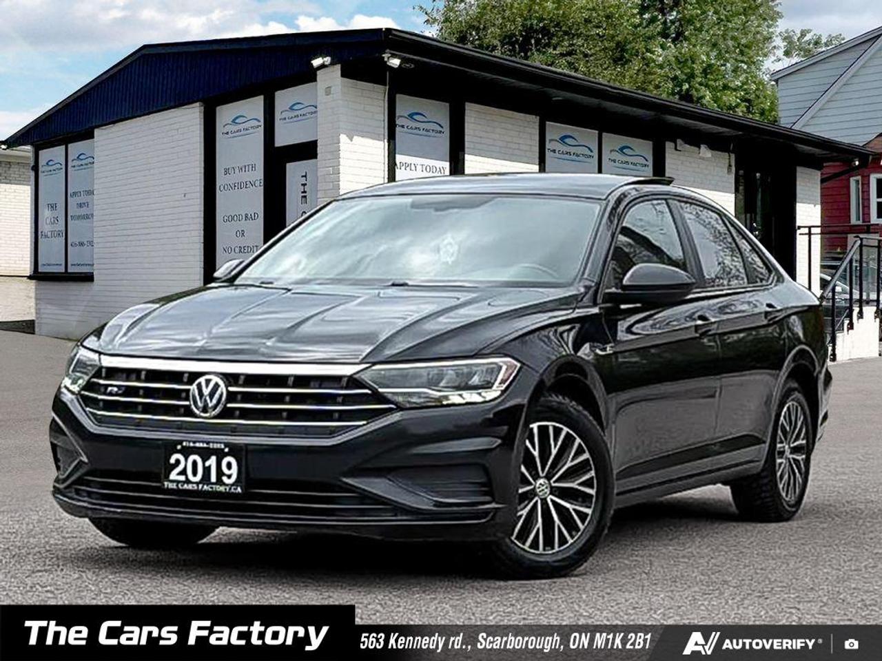 <p data-start=0 data-end=95><strong data-start=0 data-end=95>2019 Volkswagen Jetta Highline R-Line &ndash; Black on Black | Fully Loaded | Exceptionally Clean</strong></p><p data-start=97 data-end=414>Turn heads and enjoy premium comfort with this stunning 2019 Volkswagen Jetta Highline R-Line, finished in a sleek black exterior paired with a refined black interior. This top-tier trim combines sporty styling with luxury features, making it the perfect balance of performance, technology, and everyday practicality.</p><p data-start=416 data-end=612>This vehicle has been meticulously maintained and is in excellent condition inside and out. If youre looking for a stylish, fuel-efficient sedan with all the modern features, this Jetta delivers.</p><p data-start=614 data-end=1079>Powered by a responsive 1.4L turbocharged engine paired with a smooth automatic transmission, this Jetta offers an excellent blend of performance and fuel efficiency. The R-Line package enhances the driving experience with sport-inspired tuning and aggressive styling, including unique front and rear bumpers, gloss black accents, R-Line badging, and stylish alloy wheels. LED headlights and taillights, along with a power sunroof, complete the sleek exterior look.</p><p data-start=1081 data-end=1382>Inside, the cabin features premium black leather seating surfaces with heated front seats, a power-adjustable driver&rsquo;s seat, and dual-zone automatic climate control for maximum comfort. Ambient interior lighting and a leather-wrapped steering wheel add a refined touch to the already upscale interior.</p><p data-start=1384 data-end=1650>Technology is a strong highlight, with a touchscreen infotainment system that includes built-in navigation, Apple CarPlay, Android Auto, and Bluetooth connectivity. The premium audio system and fully digital cockpit provide a modern and immersive driving experience.</p><p data-start=1652 data-end=1924>Safety is equally impressive, with advanced features such as Blind Spot Monitoring, a rearview backup camera, Forward Collision Warning, Autonomous Emergency Braking, Adaptive Cruise Control, Lane Assist, and Rear Cross Traffic Alert, giving you confidence on every drive.</p><p data-start=1926 data-end=2062>This Jetta Highline R-Line offers everything you could want in a modern sedan &mdash; sporty looks, advanced safety, and luxury-level comfort.</p><p data-start=2064 data-end=2213 data-is-last-node= data-is-only-node=>Serious buyers will appreciate the condition and value of this vehicle. Contact today to schedule a viewing or test drive &mdash; this one won&rsquo;t last long.</p><p data-start=1330 data-end=1360>Available for $17,990 cash, or financed from $15,490 (6.99% O.A.C., finance fee applies).</p><p data-start=1330 data-end=1360>Welcome to The Cars Factory!</p><p data-start=1362 data-end=1444>Your Premier Destination for Quality Pre-Owned Vehicles in Scarborough, Ontario!</p><p data-start=1446 data-end=1579>Located at 563 Kennedy Rd., Scarborough, Ontario, Canada</p><p data-start=1446 data-end=1579>Appointments Available &ndash; Personalized, hassle-free service just for you!</p><p data-start=1581 data-end=2010>CERTIFIED VEHICLES YOU CAN TRUST!<br data-start=1614 data-end=1617>Drive with confidence knowing your vehicle has passed our comprehensive safety inspection &ndash; going above and beyond industry standards! We also include a fresh oil change and professional detailing before your car hits the road.<br data-start=1844 data-end=1847>Certification Package available for only $899.<br data-start=1893 data-end=1896>Note: Vehicles are not drivable unless certified and e-tested. All trade-ins welcome! Taxes and licensing extra.</p><p data-start=2012 data-end=2293>EASY FINANCING &ndash; APPROVALS MADE SIMPLE!<br data-start=2051 data-end=2054>No credit? New to Canada? Struggling with past credit history? We specialize in getting you approved! Our expert finance team will work with you no matter your situation &ndash; whether it&rsquo;s a history of bankruptcy, collections, or bad credit.</p><ul data-start=2295 data-end=2448><li data-start=2295 data-end=2345><p data-start=2297 data-end=2345>On-the-spot financing &ndash; Get approved instantly</p></li><li data-start=2346 data-end=2392><p data-start=2348 data-end=2392>Bad credit? You&rsquo;re still likely to qualify</p></li><li data-start=2393 data-end=2448><p data-start=2395 data-end=2448>Take control and start rebuilding your credit today</p></li></ul><p data-start=2450 data-end=2511>Please note: Financing is subject to an administrative fee.</p><p data-start=2513 data-end=2803>PEACE OF MIND WITH EXTENDED WARRANTIES!<br data-start=2552 data-end=2555>Don&rsquo;t leave your vehicle&rsquo;s future to chance! Protect your investment with an eligible extended warranty. We offer customizable coverage options that give you the peace of mind you deserve. Speak with our team to find the best plan for your needs!</p><p data-start=2805 data-end=3070>NO-HAGGLE PRICING &ndash; THE BEST DEAL, GUARANTEED!<br data-start=2851 data-end=2854>The Cars Factory ensures you get the best price from day one! With no-haggle pricing and constant market monitoring, we guarantee you&rsquo;re always getting an unbeatable deal. No surprises, no stress &ndash; just pure value!</p><p data-start=3072 data-end=3102>Why Choose The Cars Factory?</p><p data-start=3104 data-end=3352>At The Cars Factory, we put quality, transparency, and customer satisfaction at the forefront of everything we do. Our goal is to deliver the best experience for every customer, with a focus on making your car-buying journey smooth and enjoyable.</p><p data-start=3354 data-end=3500>Book your appointment today and discover why The Cars Factory is the smart choice for your next vehicle! Don&rsquo;t miss out on our unbeatable deals!</p><hr data-start=3502 data-end=3507><p>&nbsp;<span data-start=3509 data-end=3524>Disclaimer:</span> All vehicles are subject to HST, licensing fees, and a $22 OMVIC fee.</p>
