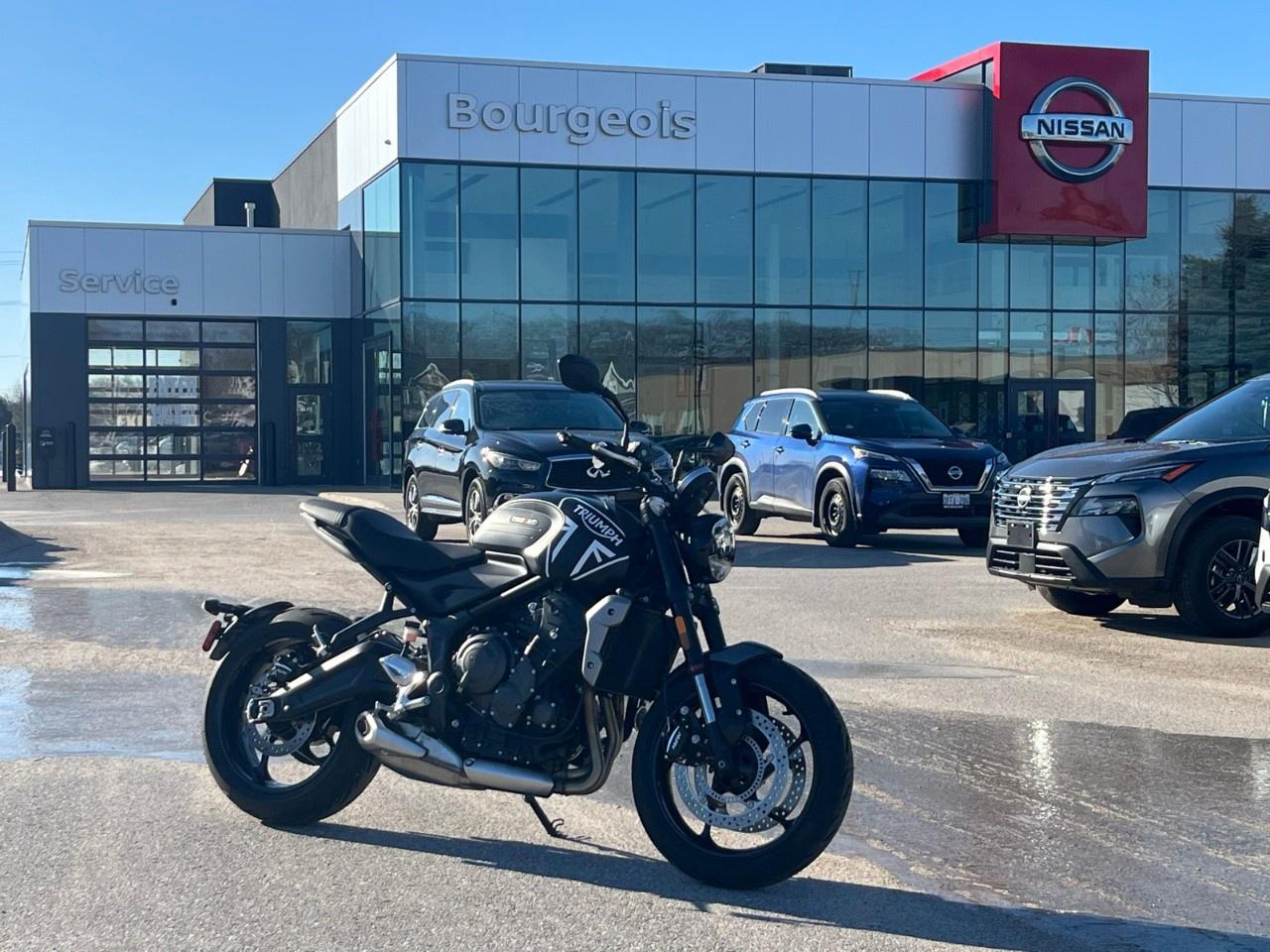 <p>Experience the thrill of the 2023 Triumph Trident, featuring a striking Yellow exterior that perfectly complements its dynamic Automatic transmission setup, promising a drive experience that's both robust and agile.</p><p>The exterior is meticulously crafted to offer not only eye-catching aesthetics but also aerodynamic efficiency. The bold Yellow color is sure to turn heads, while the Black interior invites you into a sanctuary of comfort and style, making every ride a delight. The sleek lines and distinct curves of the design highlight the modern look and feel of the Trident.</p><p>Stay connected and safe with cutting-edge technology features that the 2023 Triumph Trident offers. Robust safety features are seamlessly integrated to ensure peace of mind on every journey. A suite of driver assistance technologies aids in making every drive smooth and secure, adapting to the needs of the everyday driver.</p><p>Perfect for those who crave a mix of performance and style, the Triumph Trident is ready to meet the demands of your dynamic lifestyle. Reach out to us at the dealership to find out more about how the 2023 Triumph Trident can be the vehicle to elevate your driving experience.</p> <p><strong>Why Choose the Bourgeois Auto Group?</strong></p><p>For 80 years, Bourgeois Auto Group has been delivering exceptional automotive experiences. Our factor trained teams work to ensure you receive the shopping experience you deserve; whether you're looking for a new or new-to-you vehicle.</p><p>Shop 24/7 with our online showroom and chat service, ensuring convenience every step of the way. No hidden fees, full disclosure, and every pre-owned vehicle comes with a Carfax® report for peace of mind.</p><p>We offer a wide selection of pre-owned vehicles, all competitively priced using real-time market data. Get the best deal on your purchase and trade-in with our free Live Market Analysis report.</p><p>Looking to sell your car? We buy any make or modelno purchase required. Our simple to use online trade valuation tool will provide you with a clear, transparent selling experience whether you buy our car or not.</p><p>Backed by hundreds dedicated employees across 4 convenient locations, were here to meet all your automotive needs. Visit us in Midland or Parry Sound and explore our inventory or schedule your next service today.</p> <p><strong>Financing Your Next Vehicle with Bourgeois Midland Nissan:</strong></p><p>At Bourgeois Midland Nissan, we make financing your next vehicle simple and stress-free! Our team works with trusted lenders to find flexible options tailored to your budget. Drive away with confidenceapply today!</p><p>Take advantage of our online pre-qualification tool, backed by Equifax and TD Bank to find the payment that works for you. Simply <a href=https://www.bourgeoisnissan.com/pre-qualify-for-financing/ rel=nofollow><strong>CLICK HERE</strong></a> to use our secure online credit tool with no impact to your credit.</p>