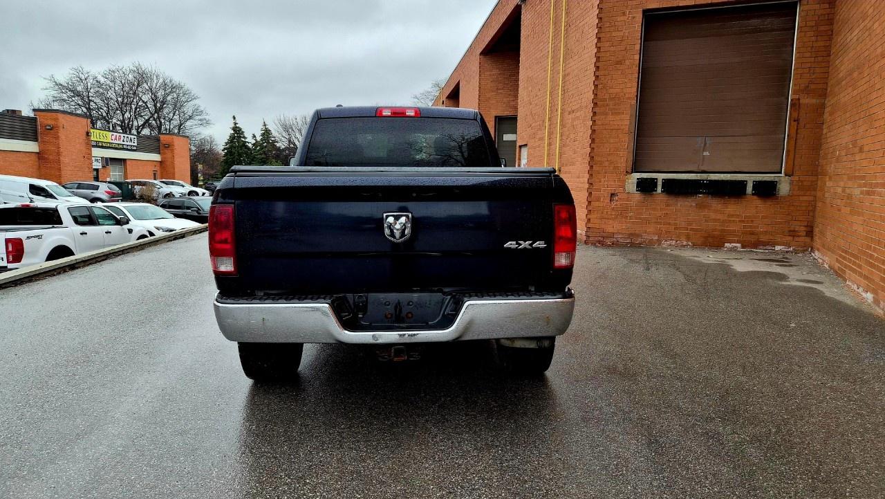 2014 RAM 1500 4WD Quad Cab 6.4 Ft Box ST Photo