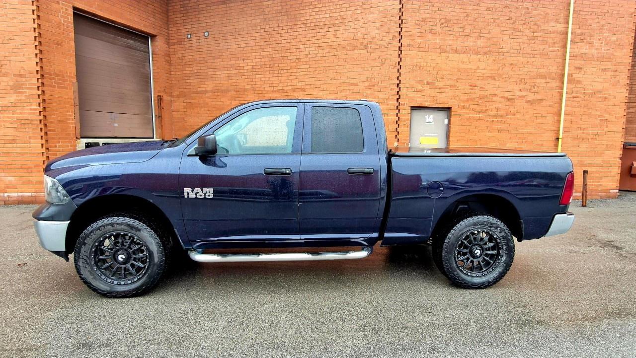 2014 RAM 1500 4WD Quad Cab 6.4 Ft Box ST Photo