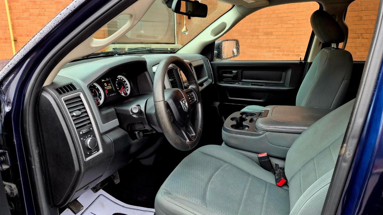2014 RAM 1500 4WD Quad Cab 6.4 Ft Box ST Photo