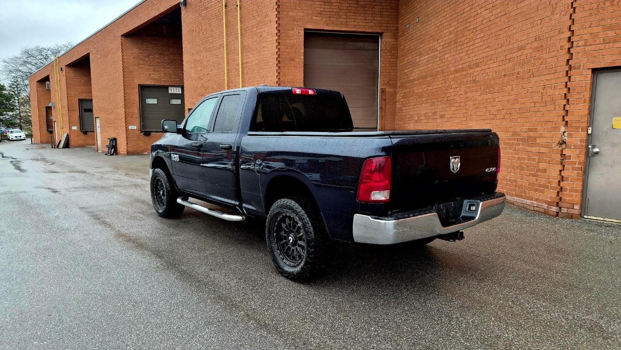 2014 RAM 1500 4WD Quad Cab 6.4 Ft Box ST Photo