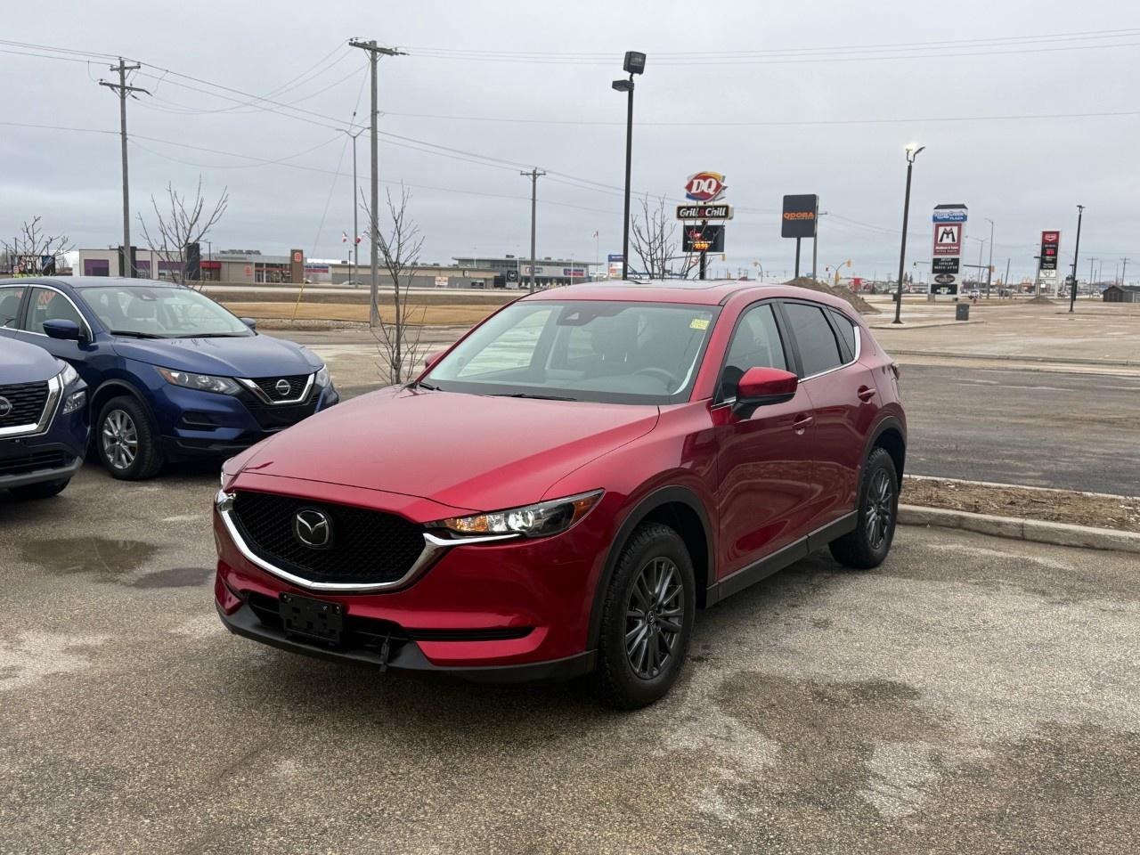 Local 1 owner trade!! This 2021 Mazda CX-5 GS with the Comfort Package balances premium refinement with everyday utility, featuring the i-Activ AWD system and a power moonroof for an open, airy cabin. The interior is significantly upgraded with dual-zone automatic climate control, rear passenger vents, and Mazda Advanced Keyless Entry, all while providing the comfort of leatherette-trimmed seats with Lux Suede inserts and a heated steering wheel. Come by Highway Mazda today!