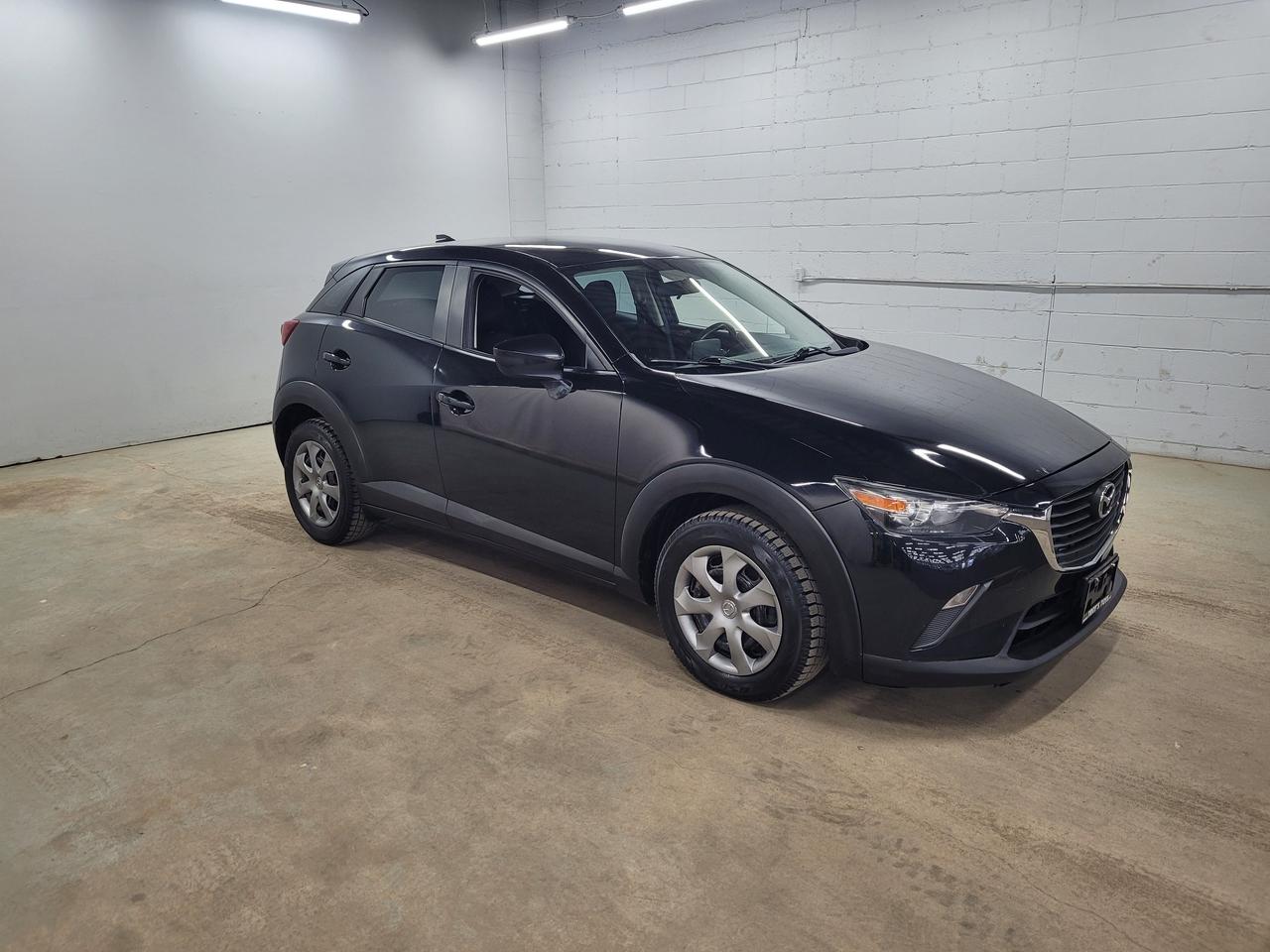 <p>Looking for a stylish and capable compact SUV? Check out this sleek black 2016 Mazda CX-3 GX, available now at Troys Toys! This well-maintained CX-3 is ready for your next adventure, boasting a comfortable black interior and the practicality of four doors. With its fuel-efficient gasoline engine and smooth automatic transmission, this CX-3 is perfect for navigating city streets or exploring scenic routes. Plus, with the added confidence of All-Wheel Drive, youll be prepared for whatever the Canadian weather throws your way. This Mazda has a reasonable 136,557km on the odometer.</p><p>This 2016 Mazda CX-3 GX is more than just a pretty face &ndash; its packed with features designed to enhance your driving experience.</p><p>Here are five reasons to get excited about this Mazda:</p><ul><li><strong>All-Wheel Drive:</strong> Conquer any road condition with confidence.</li><li><strong>Automatic Transmission:</strong> Experience effortless driving with smooth gear changes.</li><li><strong>Fuel Efficiency:</strong> Save money at the pump with its economical gasoline engine.</li><li><strong>Compact Design:</strong> Enjoy easy maneuverability and parking in tight spaces.</li><li><strong>Stylish Design:</strong> Make a statement with its head-turning black exterior.</li></ul><p><strong><em>Powered by AutoIntelligence&trade;</em></strong> Vehicle information has been generated using artificial intelligence and is provided for informational purposes only. While efforts are made to ensure accuracy, please confirm all details directly with the dealer.</p>