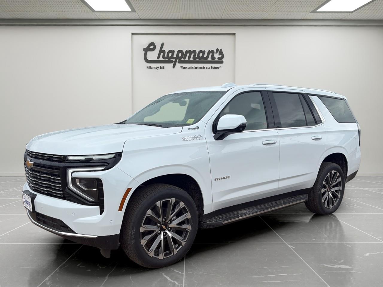 <p>Finished in stunning Polar White Tricoat with a Jet Black interior, this 2026 Chevrolet Tahoe High Country 4WD delivers premium luxury, advanced technology, and impressive V8 performance in a full-size SUV built for families, towing, and long-distance travel. As the top-tier High Country trim, it offers premium materials, cutting-edge driver assistance features, and exceptional comfort for up to seven passengers.</p><p>Powered by the legendary 6.2L EcoTec3 V8 engine paired with a 10-speed automatic transmission, this Tahoe provides smooth power delivery, impressive towing capability, and confident performance. Equipped with Magnetic Ride Control, a limited-slip rear differential, and the Sun & Tow Package, it's ready for everything from family road trips to towing your boat or camper.</p><h3>Performance & Capability</h3><p> 6.2L EcoTec3 V8 engine  10-speed automatic transmission  4WD with Autotrac 2-speed transfer case  Magnetic Ride Control suspension  Limited-slip rear differential  Advanced Trailering Package  Integrated trailer brake controller  Smart Trailer Integration Indicator  Hitch Guidance with Hitch View  Extra-capacity cooling system  Hill Descent Control  Engine block heater  Trailering equipment package</p><h3>Interior Comfort & Convenience</h3><p> Heated and ventilated front bucket seats  Heated second-row seats  Power-release second-row bucket seats  Power-folding third-row seating  Adaptive Cruise Control  Heated steering wheel  Power tilt and telescoping steering column  Wireless phone charging  Power-sliding centre console  Driver memory settings  Remote vehicle start  Panoramic sunroof</p><h3>Technology & Connectivity</h3><p> Bose Centerpoint surround sound system  Head-Up Display  11" Driver Information Centre  Wireless Apple CarPlay  Wireless Android Auto  SiriusXM capability  OnStar connected services  Rear Camera Mirror with washer  Push-button start  Keyless entry</p><h3>Safety & Driver Assistance</h3><p> HD Surround Vision  Enhanced Automatic Emergency Braking  Forward Collision Alert  Front Pedestrian Braking  Enhanced Automatic Parking Assist  Lane Keep Assist with Lane Departure Warning  Blind Zone Steering Assist with Trailering  Rear Cross Traffic Braking  Rear Pedestrian Alert  Safety Alert Seat  IntelliBeam automatic high beams  Teen Driver technology</p><h3>Exterior Highlights</h3><p> Polar White Tricoat exterior  22" bright machined aluminum wheels  Power liftgate with programmable height  Rain-sensing windshield wipers  Panoramic sunroof  Premium High Country exterior styling  Chrome exterior accents</p><p>Whether you're towing a trailer, loading up the family for a road trip, or simply enjoying the luxury of a premium SUV, the Tahoe High Country delivers exceptional capability, comfort, and technology in one impressive package.</p><p>2 Year/24,000 kilometer* Complimentary Oil Changes (2 total)</p><p>3 Year/60,000 kilometer* Base Warranty Coverage</p><p>5 Year/100,000 kilometer* Powertrain Component Warranty Coverage</p><p>5 Year/100,000 kilometer* Courtesy Transportation and 24/7 Roadside Assistance</p><p>6 Year/160,000 kilometer* Sheet Metal (Rust Through) Perforation Warranty Coverage</p><p>*Whichever Comes First.</p><p>Price Includes Dealer Fee.</p><p>Price Excludes PST & GST.</p><p>Financing Options Available, Call For More Details.</p> <p><strong>*While every reasonable effort is made to ensure the accuracy of this information, we are not responsible for any error or omissions contained on these pages. Please verify any information in question with Chapman Motors Ltd.</strong></p>