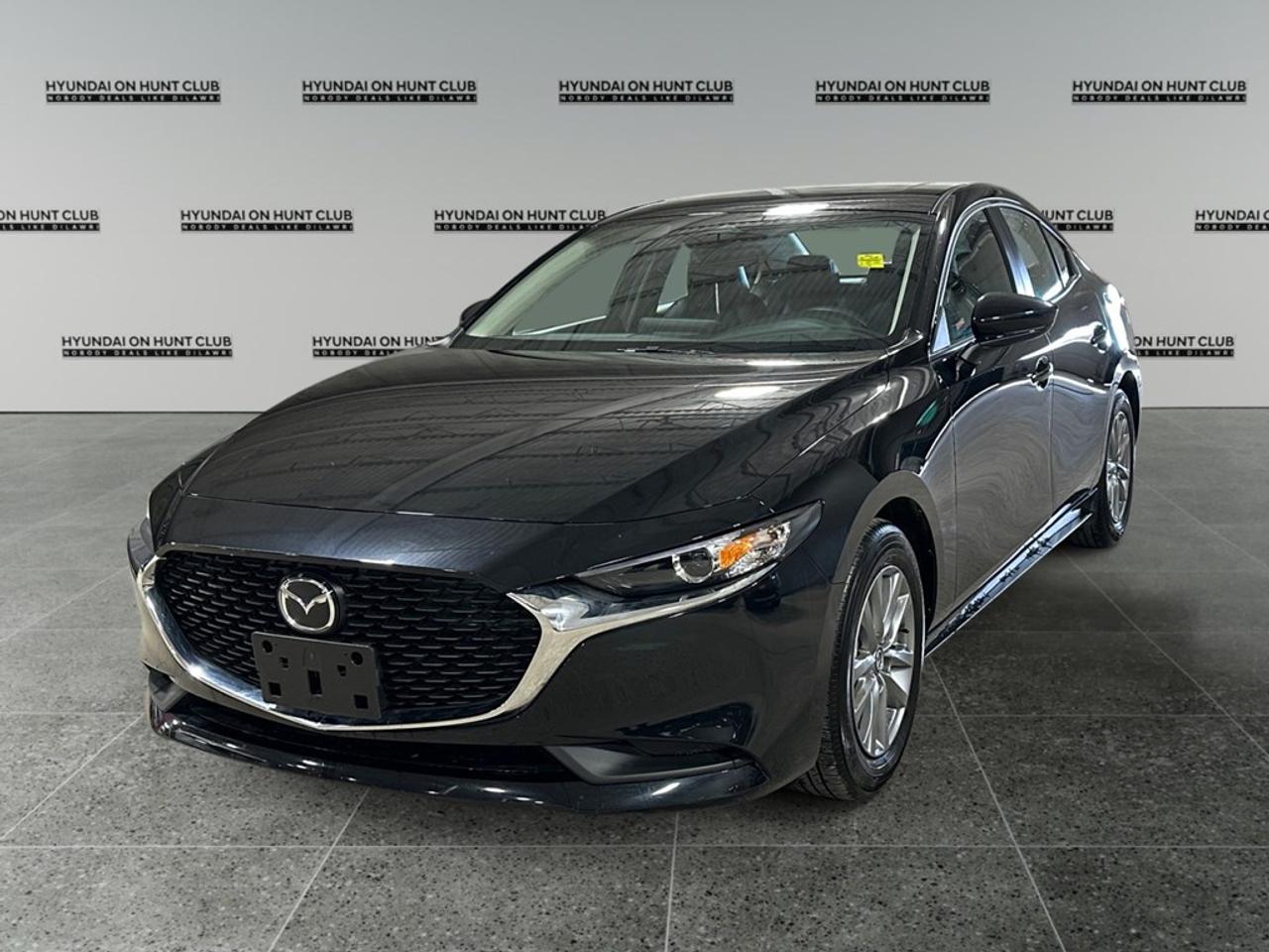 * $28,999 Cash * $26,888 Finance Experience the allure of the 2025 Mazda Mazda3 GS in a stunning black color with an agile FWD drivetrain that ensures a refined handling experience. This sedan is designed for those who appreciate both style and substance in their drive. The Mazda3 boasts an impressive suite of features including sleek alloy wheels that perfectly complement its streamlined body. Inside, occupants can enjoy luxurious comfort with heated front seats, a leather steering wheel, and a leather gear shifter. The smart inclusion of a backup camera and power windows elevates convenience to new heights. Modern technologies grace the Mazda3, incorporating smart device integration and seamless Bluetooth connectivity for a connected journey. Safety innovations such as lane assist and adaptive cruise control provide peace of mind, allowing drivers to feel secure on every adventure. With heated mirrors and a heated steering wheel, comfort and control are attainable in all weather conditions. The 2025 Mazda3 GS is ideal for savvy urban commuters and families desiring a blend of efficiency, technology, and style. Contact our dealership today for more information on how you can make this remarkable sedan yours. **ADVERTISED PRICE IS FOR FINANCE DEALS ONLY, CASH PRICE MAY BE SUBJECT TO INCREASE. SEE DEALER FOR DETAILS**