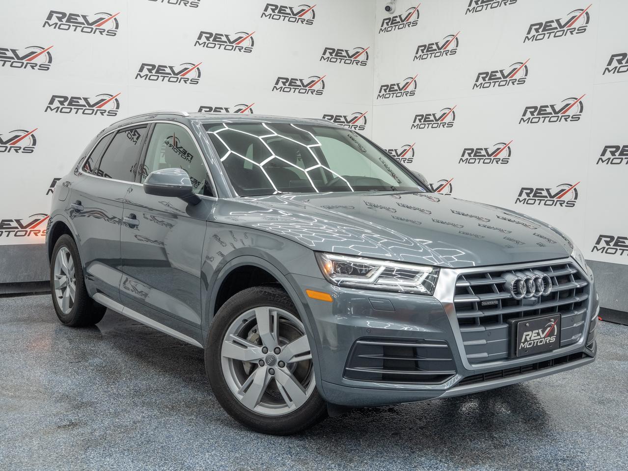 2019 Audi Q5 Prestige 45 TFSI quattro | Apple CarPlay | Panoramic Roof | Heated Seats |<br/> <br/> Silver Metallic Exterior | Black Leather Interior | 19‑Inch 5‑Arm‑Star Wheels | Matrix‑Design LED Headlights | Panoramic Sunroof | Heated Front & Rear Seats | Heated Steering Wheel | Tri‑Zone Climate Control | Audi Virtual Cockpit | MMI Navigation Plus | Apple CarPlay | Android Auto | Bang & Olufsen 3D Sound | Top‑View Camera System | Adaptive Cruise Control | Blind Spot Monitoring | 2.0L Turbocharged | 248 Horsepower | 7‑Speed S tronic | quattro All‑Wheel Drive | and more <br/> <br/> <br/> The 2019 Audi Q5 Prestige 45 TFSI combines refined luxury, advanced technology, and confident quattro performance in a sleek, modern SUV. With its elegant Silver exterior and clean Black interior, this Q5 delivers a premium driving experience tailored for comfort, capability, and sophistication. <br/> <br/> <br/> Key Features <br/> <br/> <br/> Modern, Refined Exterior <br/> The Silver Metallic finish highlights the Q5’s sculpted body lines, signature Singleframe grille, and sharp LED lighting. Its balanced proportions and 19‑inch wheels create a look that’s both upscale and athletic, suitable for city streets or weekend escapes. <br/> <br/> <br/> Premium, Comfort‑Focused Interior <br/> Inside, the Black leather cabin offers a quiet, upscale environment with meticulous Audi craftsmanship. Heated front and rear seats, a heated steering wheel, and tri‑zone climate control ensure year‑round comfort. The Prestige trim adds top‑tier materials and advanced convenience features throughout. <br/> <br/> <br/> Turbocharged quattro Performance <br/> Powered by a 2.0L turbocharged engine producing 248 hp, the Q5 delivers smooth, responsive acceleration. The 7‑speed S tronic dual‑clutch transmission provides quick, precise shifts, while Audi’s legendary quattro all‑wheel‑drive system ensures confident traction in all weather conditions. <br/> <br/> <br/> Advanced Technology & Connectivity <br/> The Audi Virtual Cockpit offers a fully digital, customizable instrument display, paired with MMI Navigation Plus for intuitive control. Apple CarPlay, Android Auto, and the Bang & Olufsen 3D sound system elevate every drive with seamless connectivity and premium audio clarity. <br/> <br/> <br/> Intelligent Safety & Driver Assistance <br/> The Prestige package includes a comprehensive suite of driver‑assistance features such as Adaptive Cruise Control, Blind Spot Monitoring, Top‑View Camera System, and Rear Cross‑Traffic Assist, enhancing awareness and confidence in every situation. <br/> <br/> <br/> The 2019 Audi Q5 Prestige 45 TFSI is a luxurious, well‑equipped SUV designed for drivers who value comfort, technology, and all‑weather capability. With its elegant styling, advanced features, and proven quattro performance, it delivers a premium experience on every road <br/> <br/> <br/> This Vehicle Has Travelled 47,043 Kms. <br/> <br/> <br/> *** NO additional fees except for taxes and licensing! *** <br/> <br/> <br/> *** 100-point inspection on all our vehicles & always detailed inside and out *** <br/> <br/> <br/> RevMotors is at your service to ensure you find the right car for YOU. Even if we do not have it in our inventory, we are more than happy to find you the vehicle that you are looking for. Give us a call at 613-791-3000 or visit us online at www.revmotors.ca <br/> <br/> <br/> Ça nous donnera du plaisir de vous servir en Français aussi! <br/> <br/> <br/> CERTIFICATION * All our vehicles are sold Certified for the province of Ontario (Quebec Safety Available, additional charges may apply) <br/> FINANCING AVAILABLE * RevMotors offers competitive finance rates through many of the major banks. Should you feel like youve had credit issues in the past, we have various financing solutions to get you on the road. We accept No Credit - New Credit - Bad Credit - Bankruptcy - Students and more!! Please keep in mind the default loan structure found on the vehicle page is a template. The exact rate and terms that a vehicle qualifies for may differ. All quotes are subject to lender approval. <br/> EXTENDED WARRANTY * For your peace of mind, if one of our used vehicles is no longer covered under the manufacturer’s warranty, RevMotors will provide you with a 6 month / 6000KMS Limited Powertrain Warranty. You always have the options to upgrade to more comprehensive coverage as well. Well be more than happy to review the options and chose the coverage thats right for you! <br/> TRADES * Do you have a Trade-in? We offer competitive trade in offers for your current vehicle! <br/> SHIPPING * We can ship anywhere across Canada. Give us a call for a quote and we will be happy to help! <br/> <br/> <br/> Buy with confidence knowing that we always have your best interests in mind! <br/>